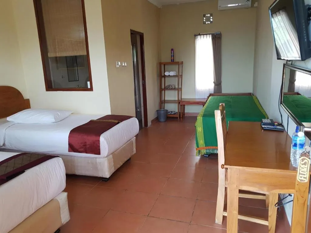 Bed in Mario Hotel and Cafe