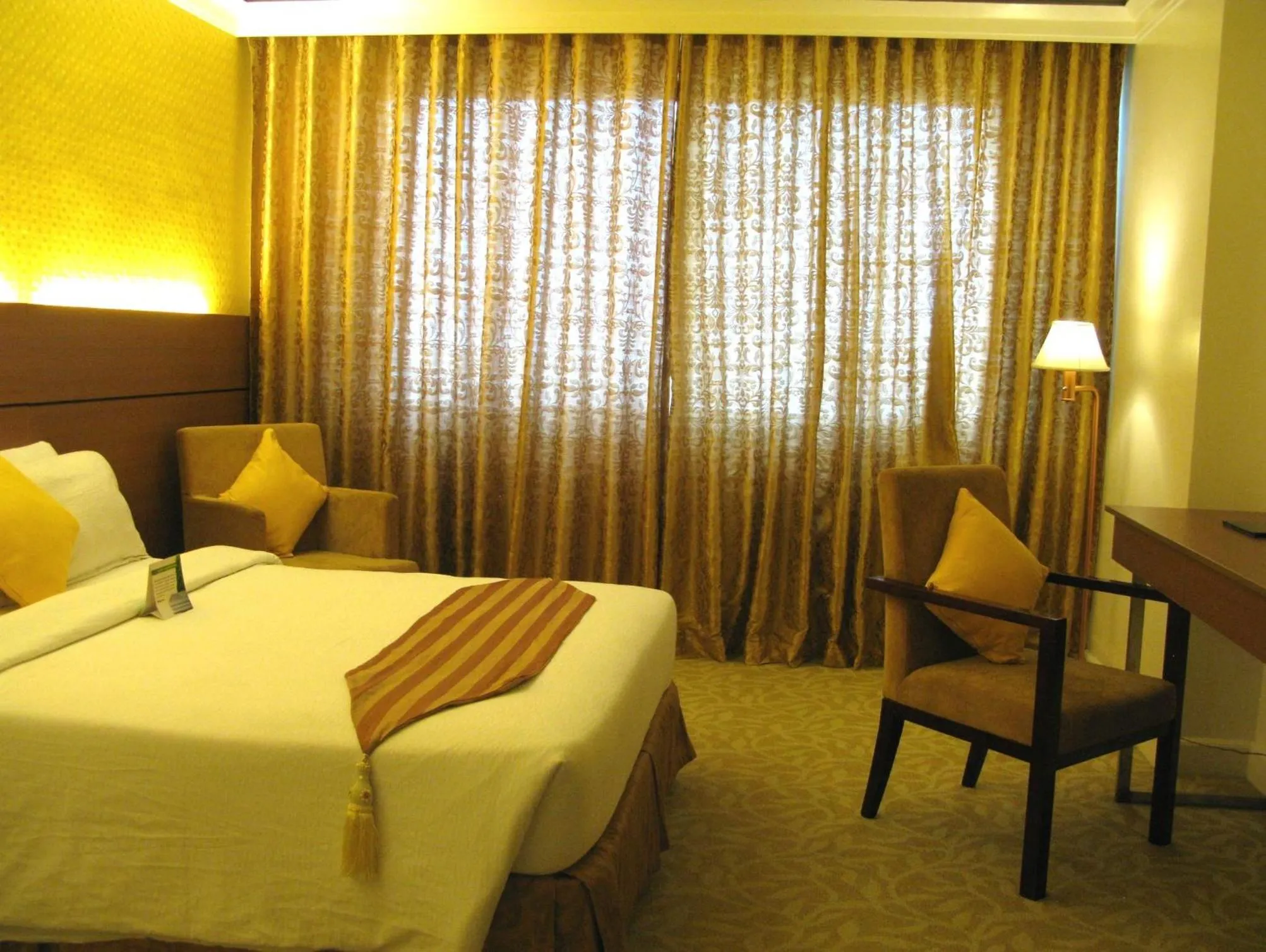 Property building, Bed in The Royal Mandaya Hotel
