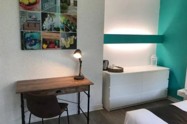 Bedroom in Logis Latitude Ouest Hôtel Restaurant & Spa