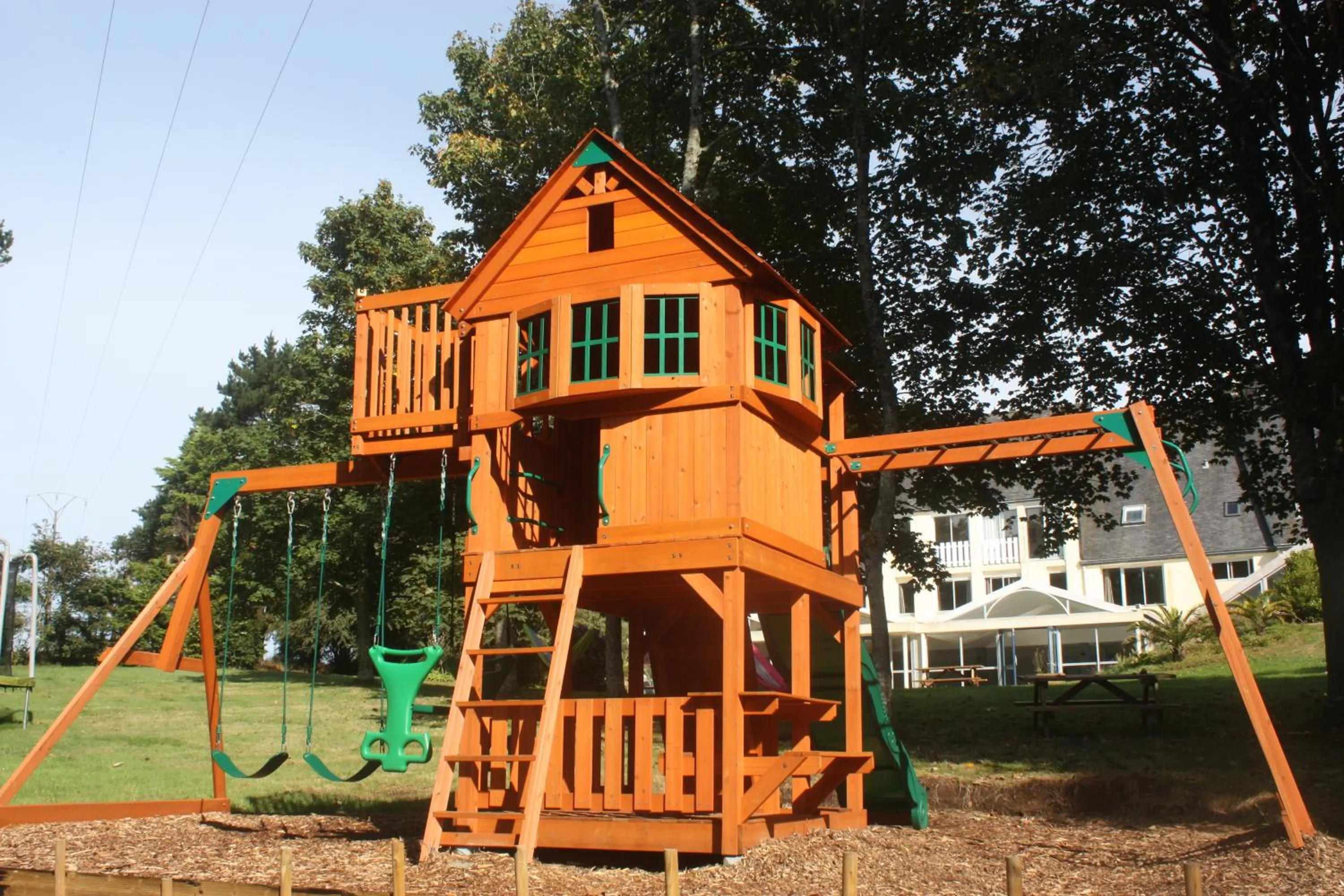 Children play ground in Logis Latitude Ouest Hôtel Restaurant & Spa
