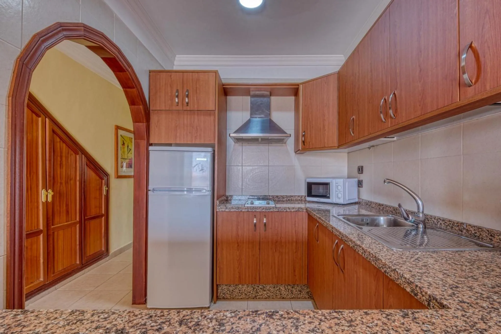 Kitchen or kitchenette in Apartamentos Callaomar