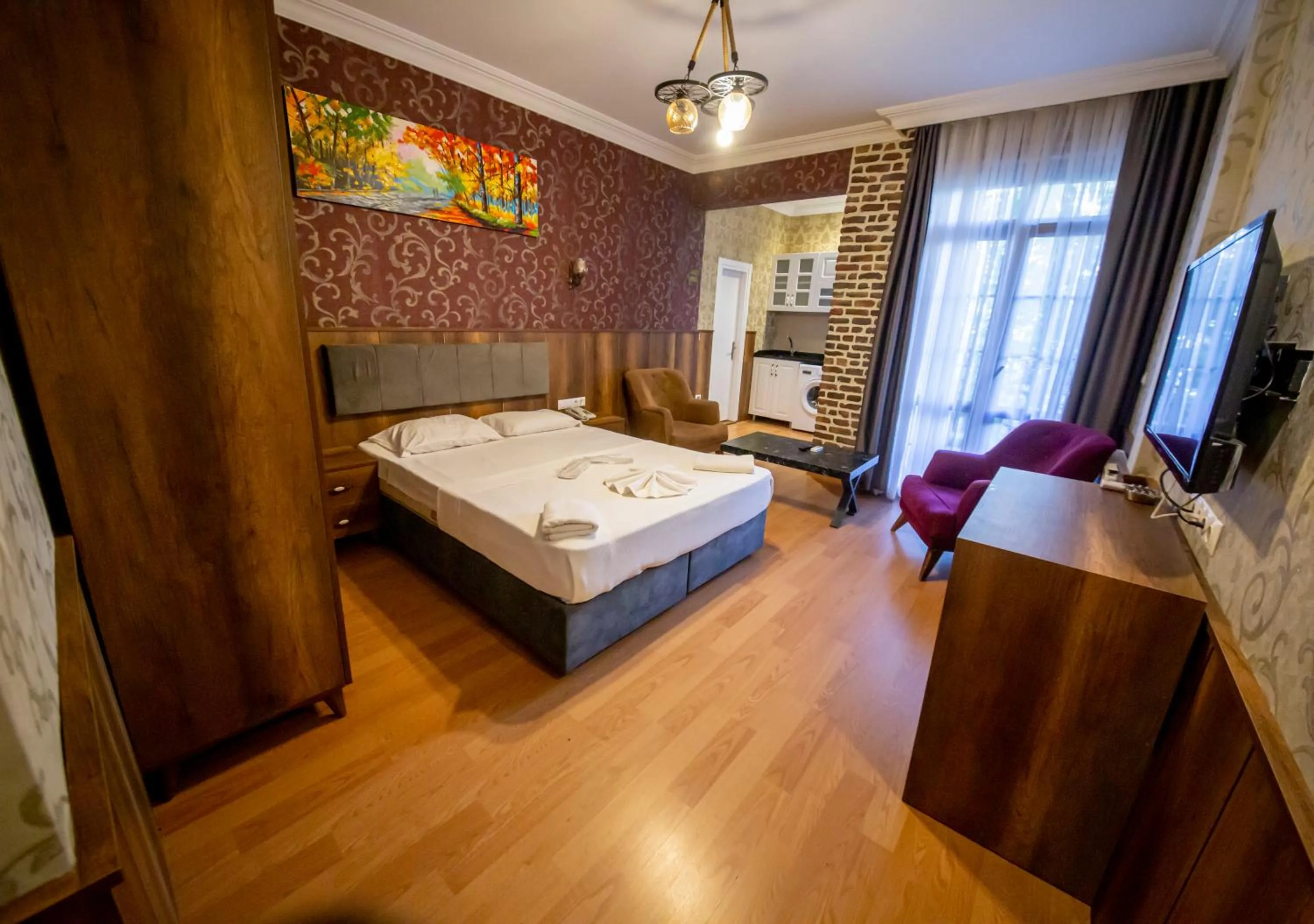 Bed in Royal Garden Suite and Hotel