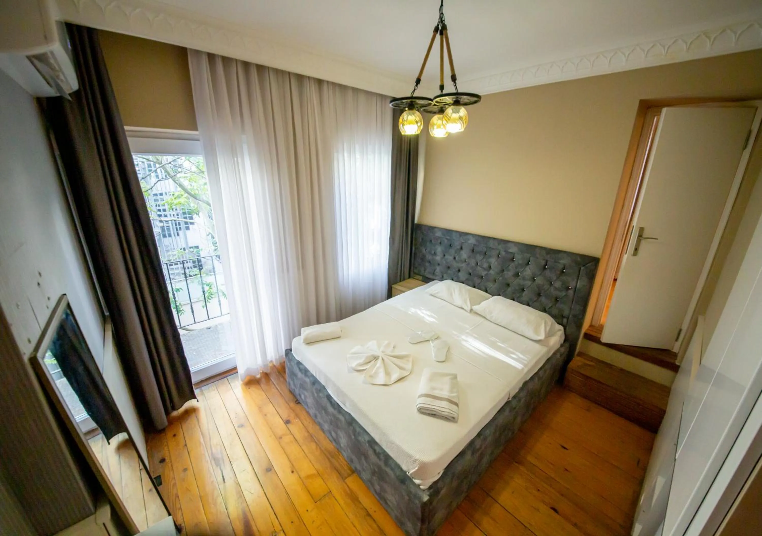 Bed in Royal Garden Suite and Hotel