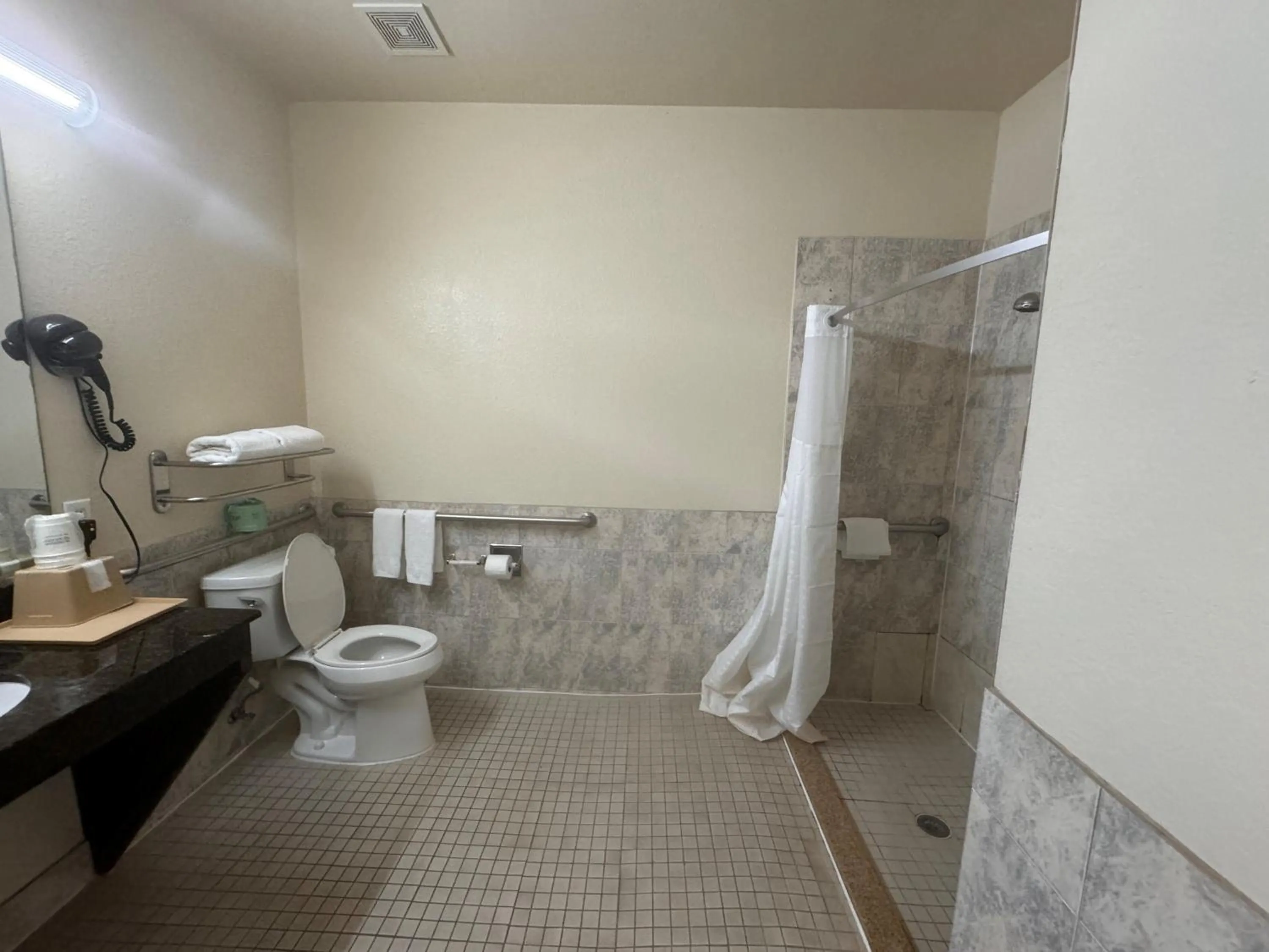 Bathroom in Super 8 by Wyndham Brookshire TX