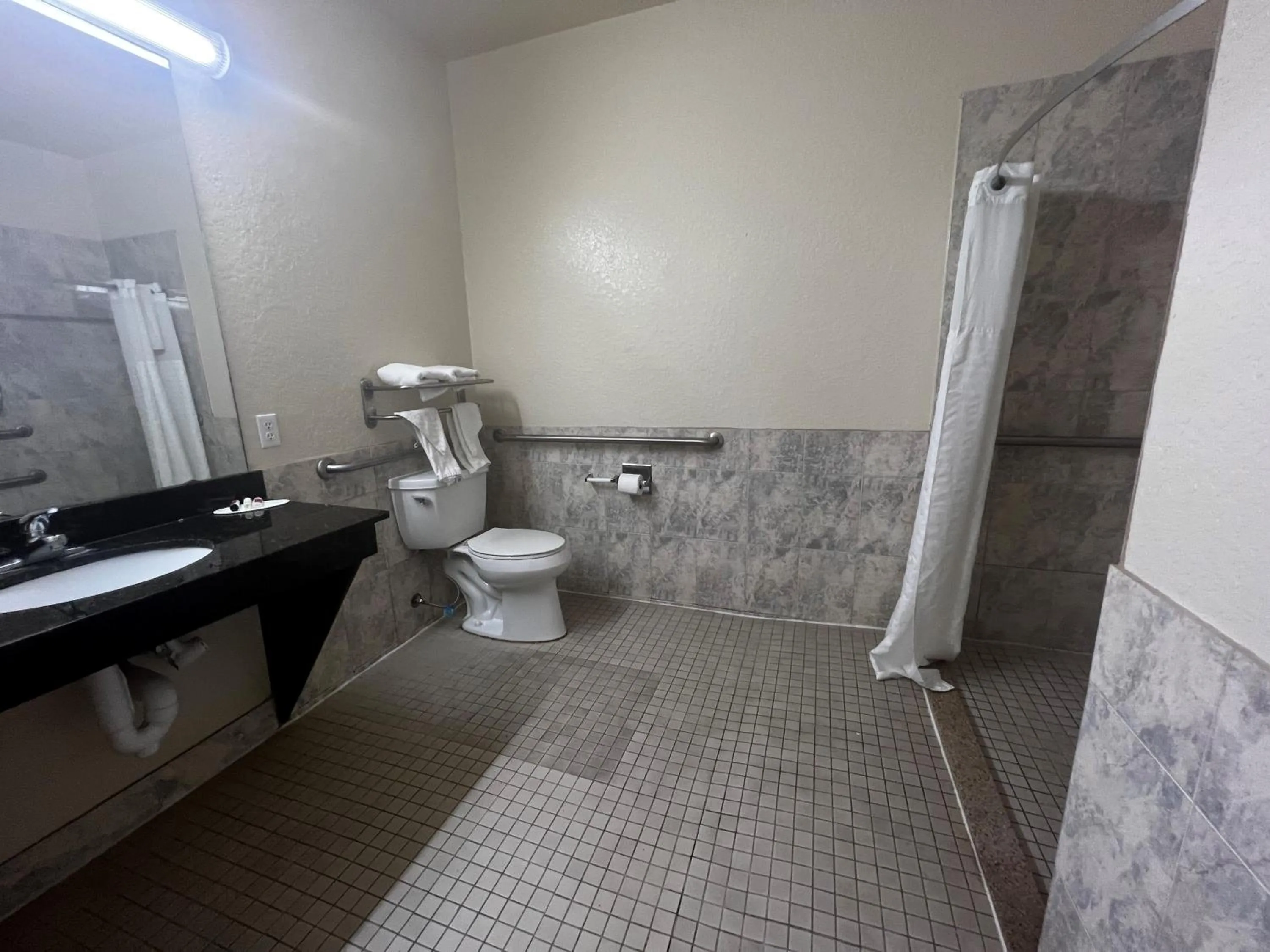 Bathroom in Super 8 by Wyndham Brookshire TX