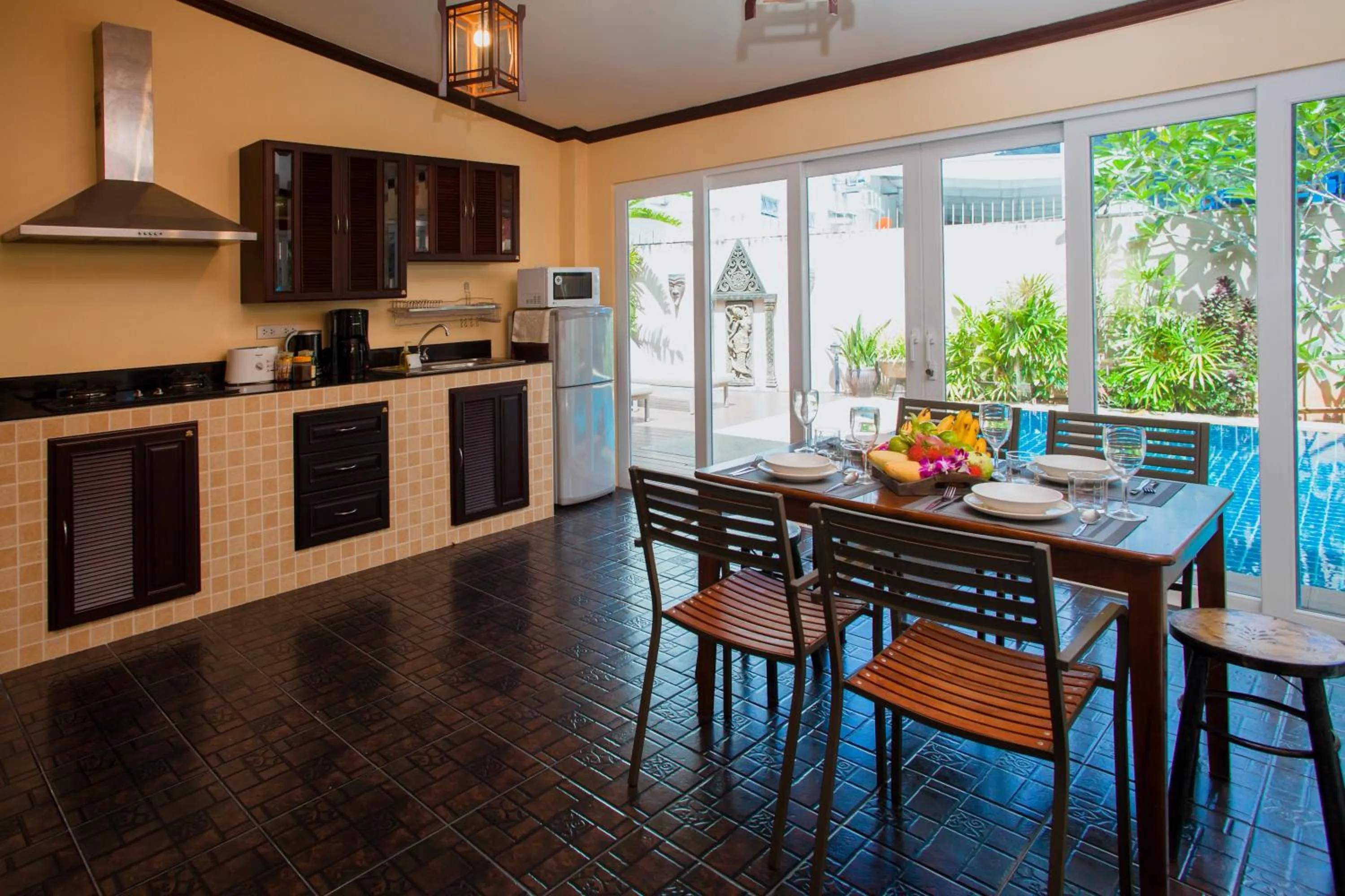 Dining area in Baan Manuchang Villa, SHA Certified