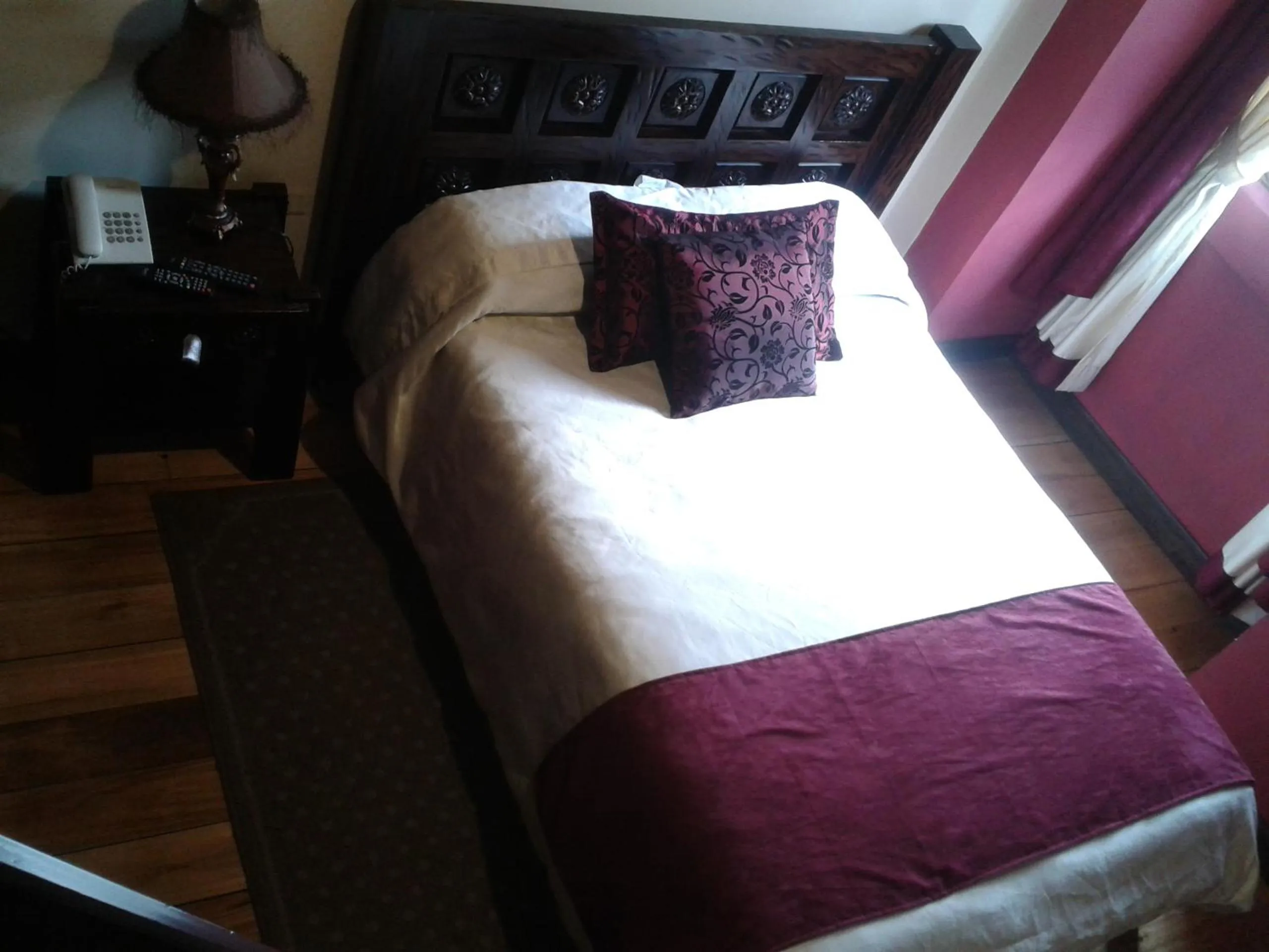 Bed in La Posada Cuencana Hotel