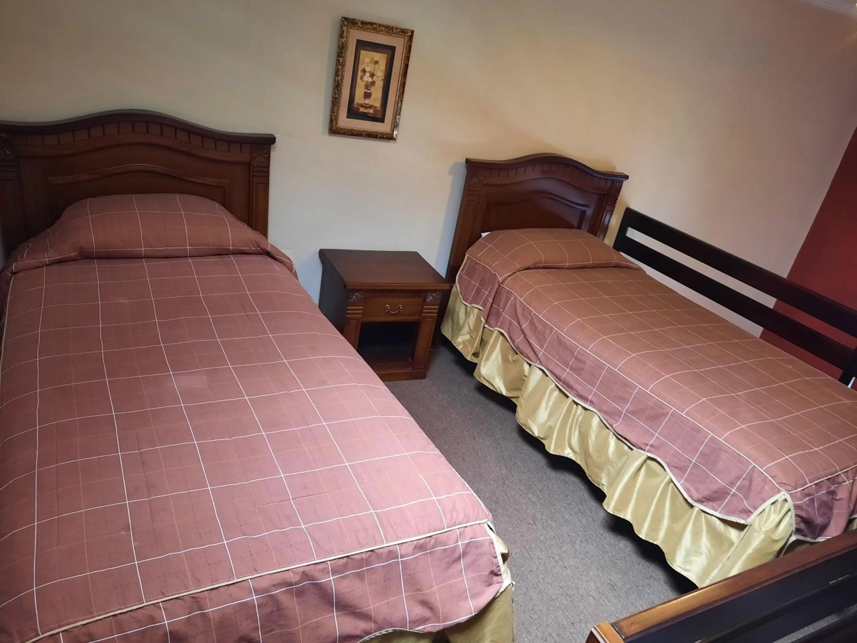 Bed in La Posada Cuencana Hotel