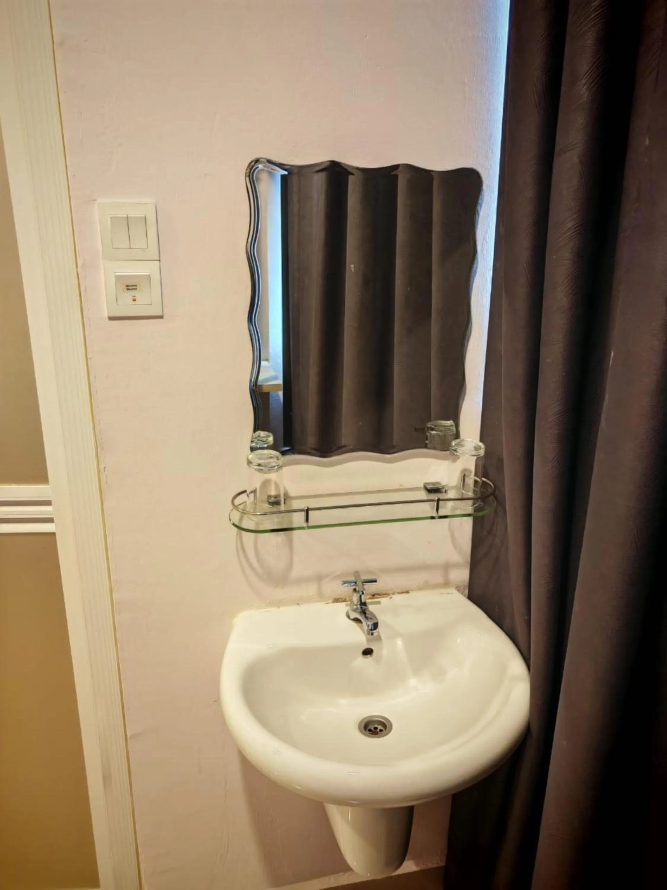 Bathroom in Grand FC Hotel