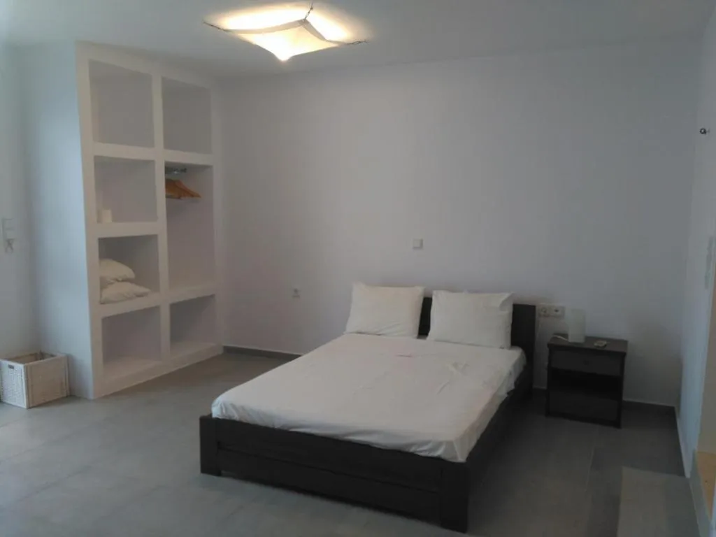 Bed in Milos Bay Suites