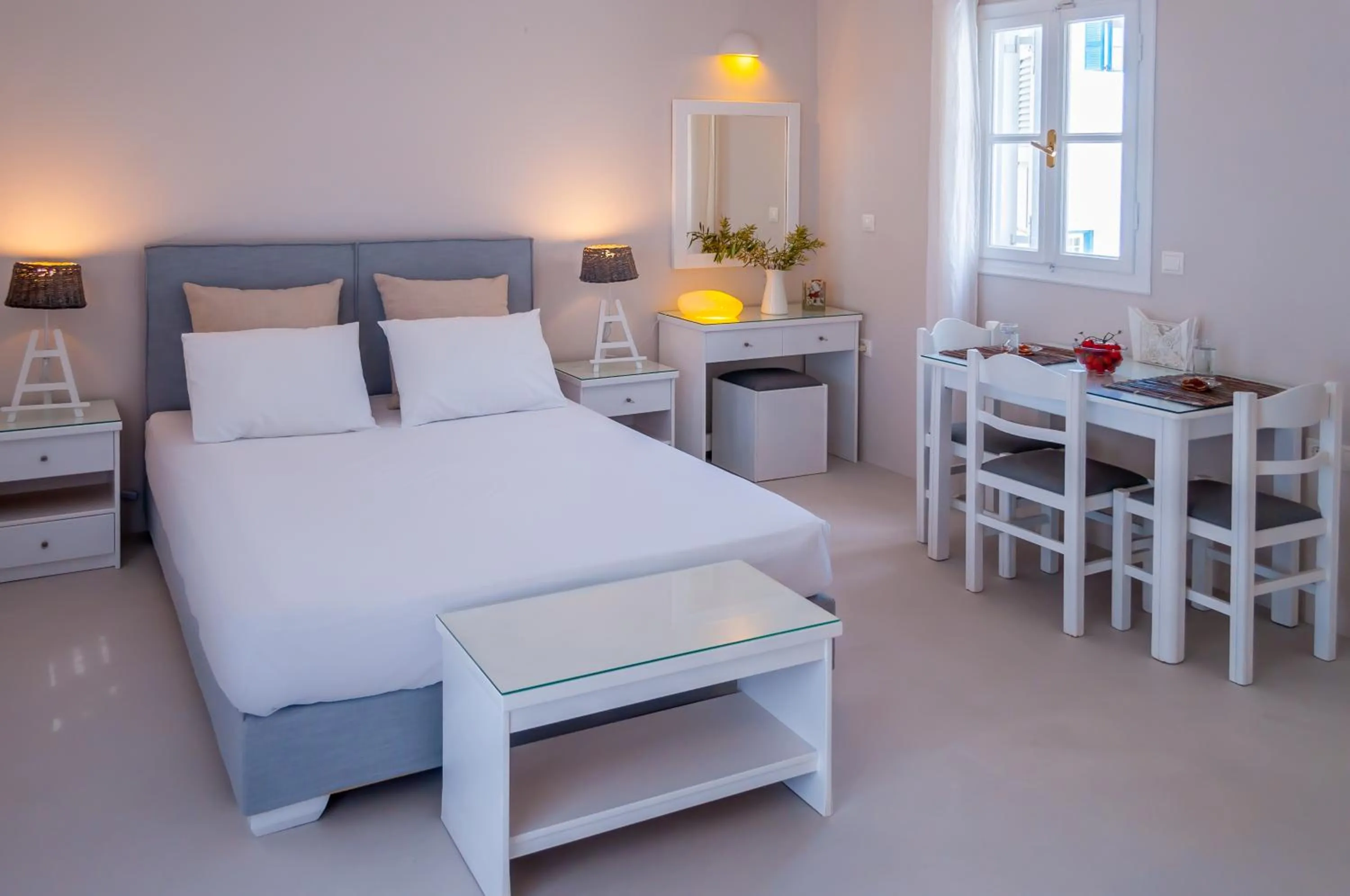 Bed in Milos Bay Suites
