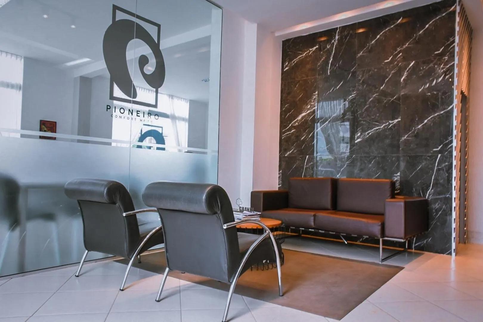 Lobby or reception in Pioneiro Hotel
