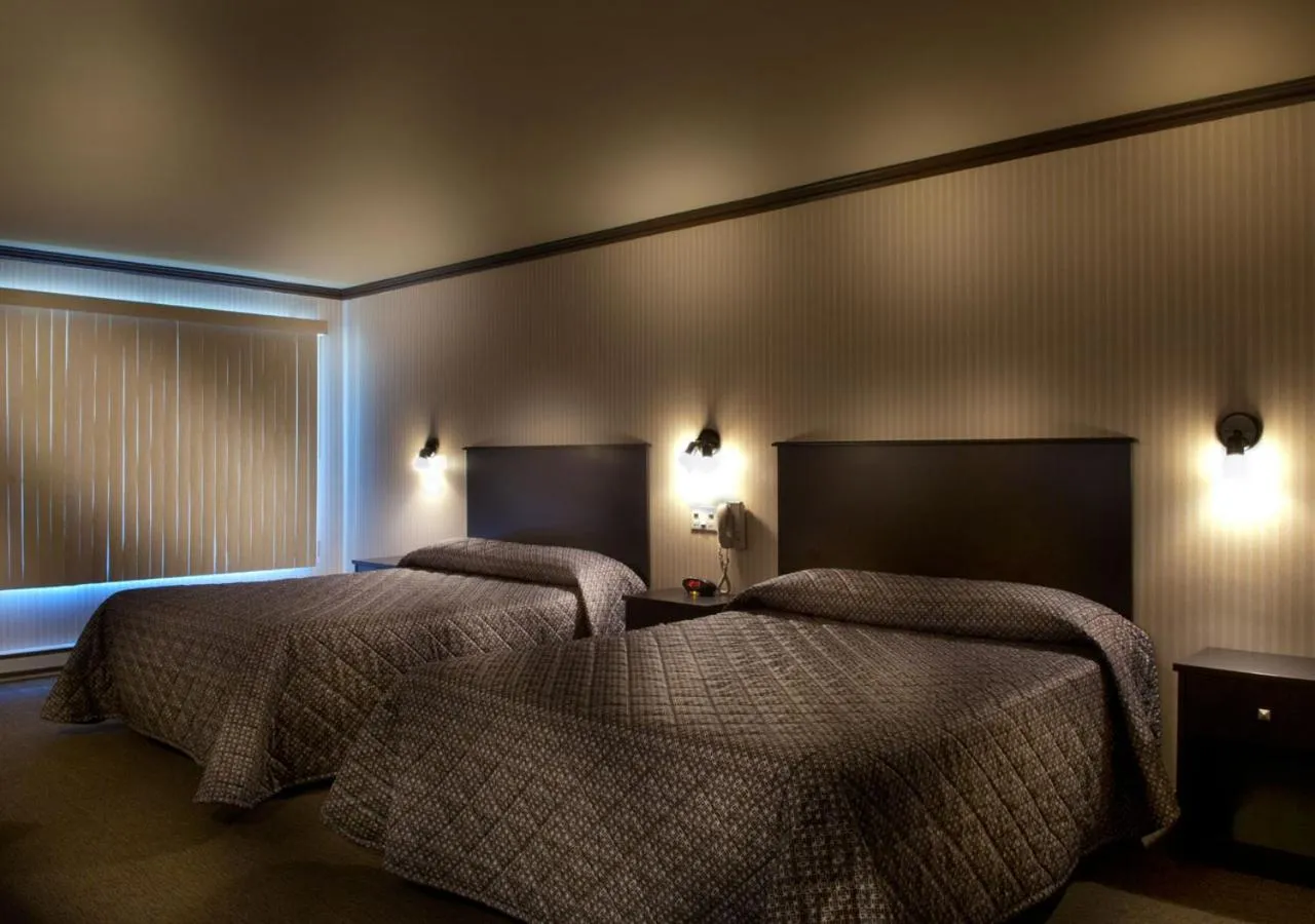 Bed in Ramada by Wyndham Laval