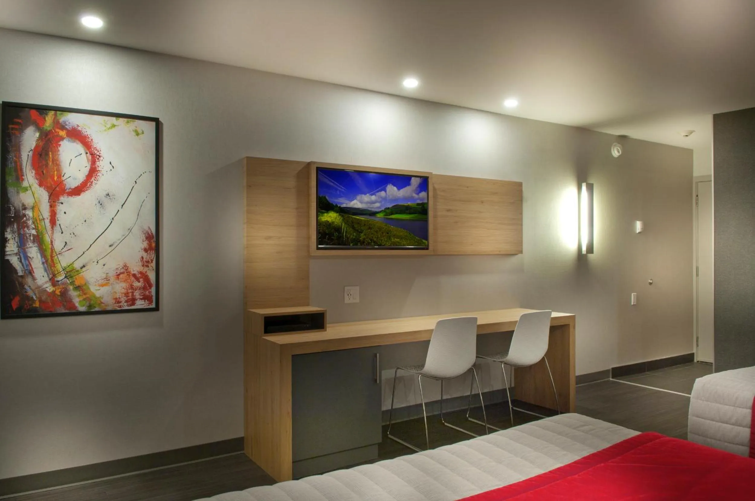 Seating area, Bed in Ramada by Wyndham Laval