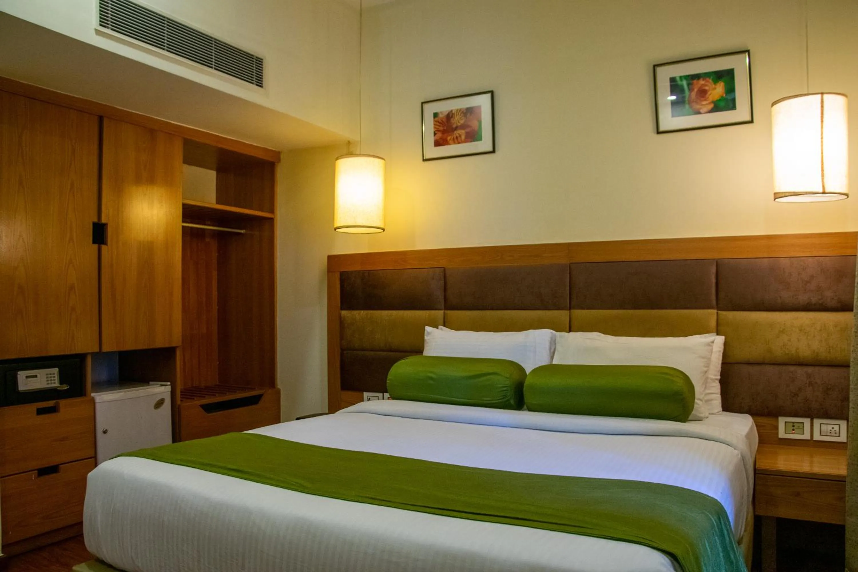 Bed in Hotel Ramanashree Richmond