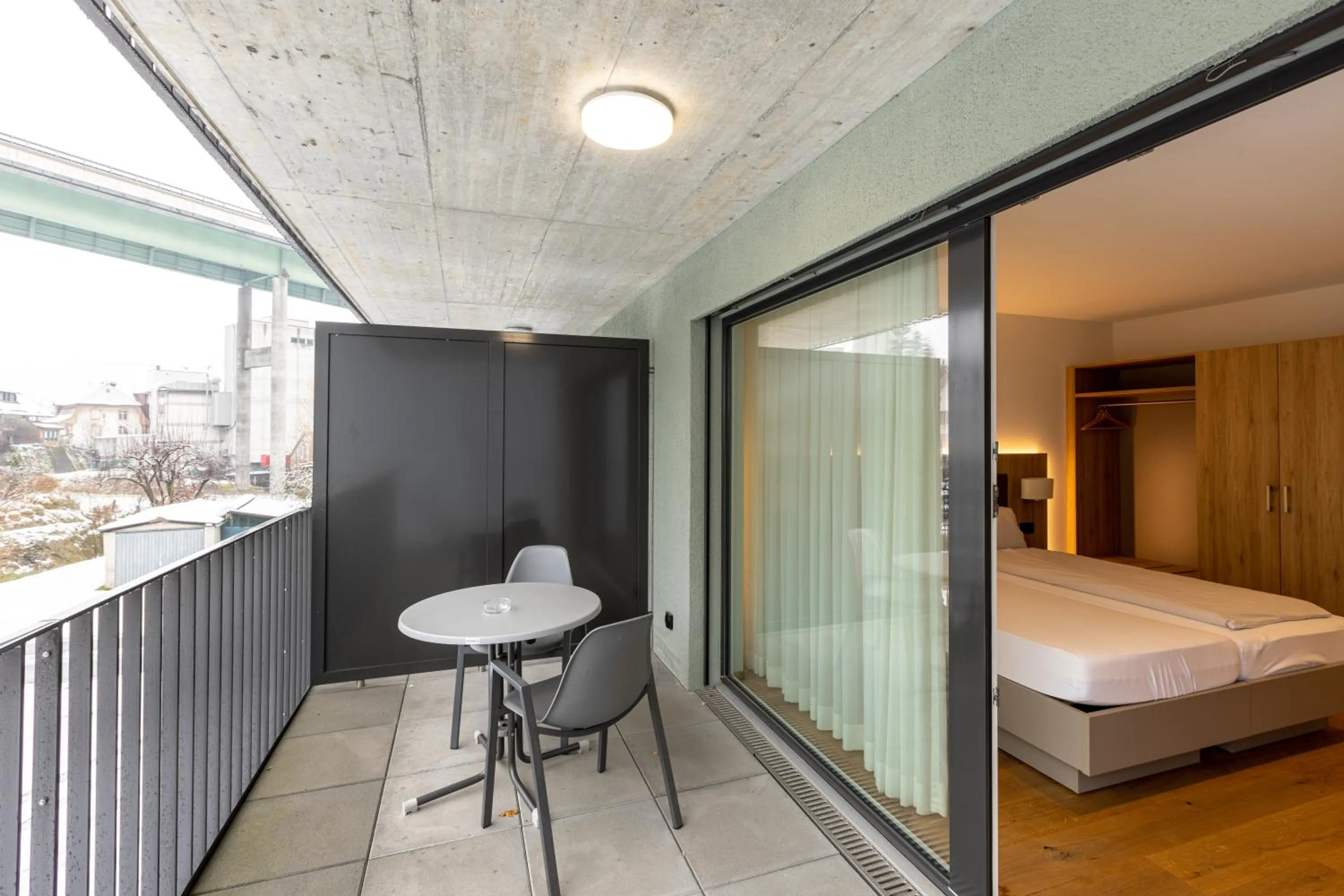 Balcony/Terrace, Bed in Hotel Flamatt