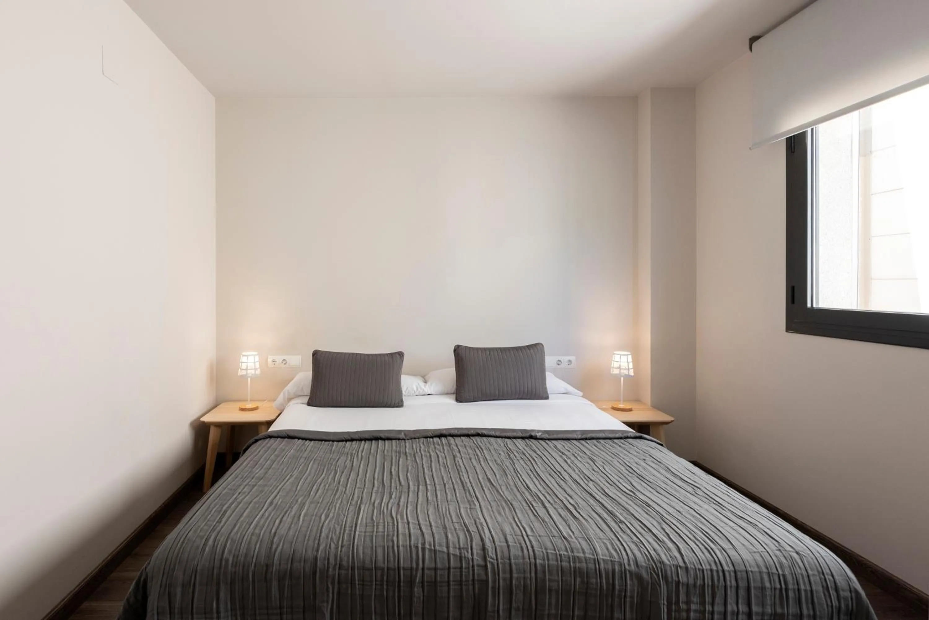 Bed in Espais Blaus Apartments
