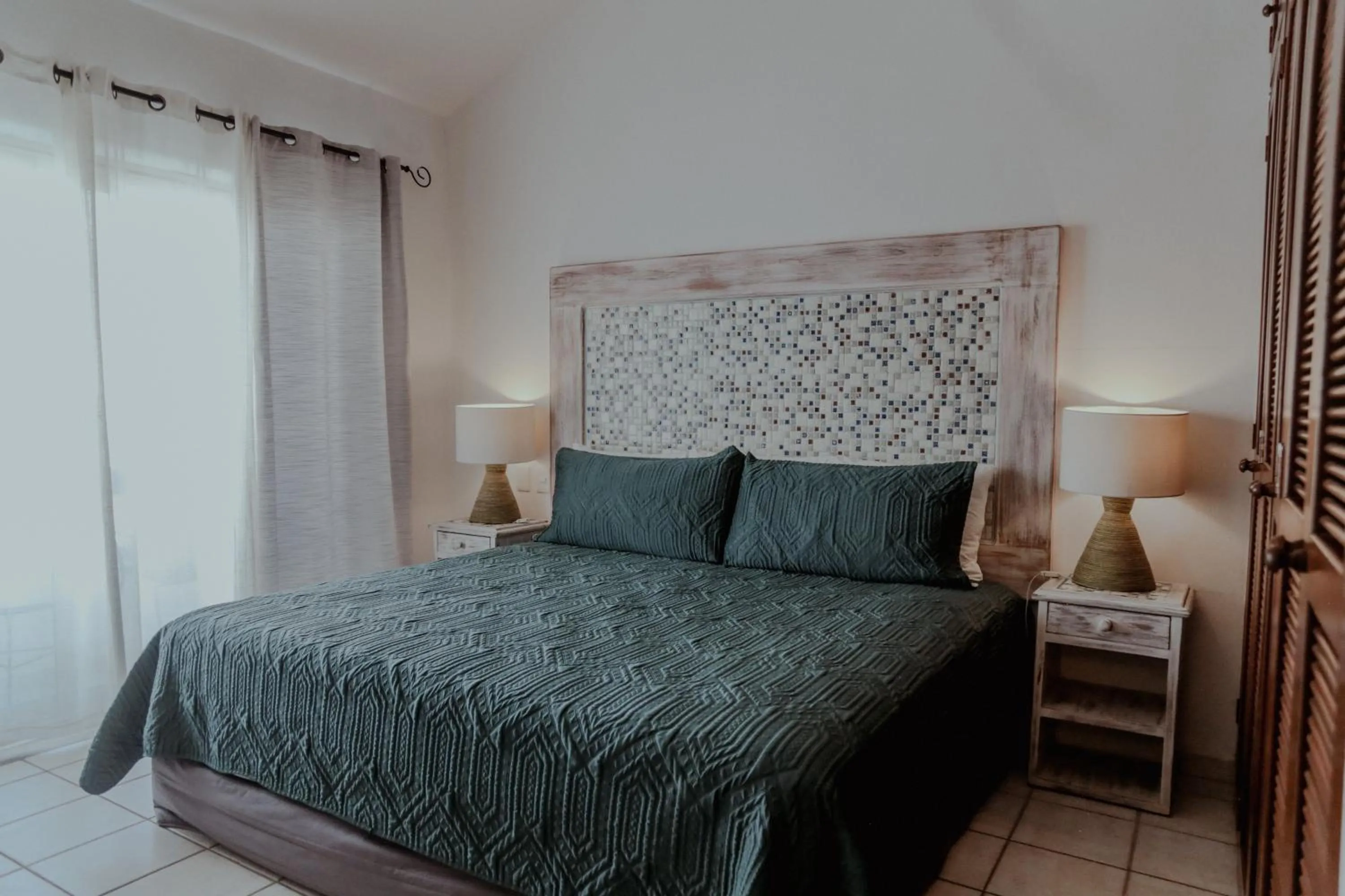 Bed in Fabiola Condo Hotel