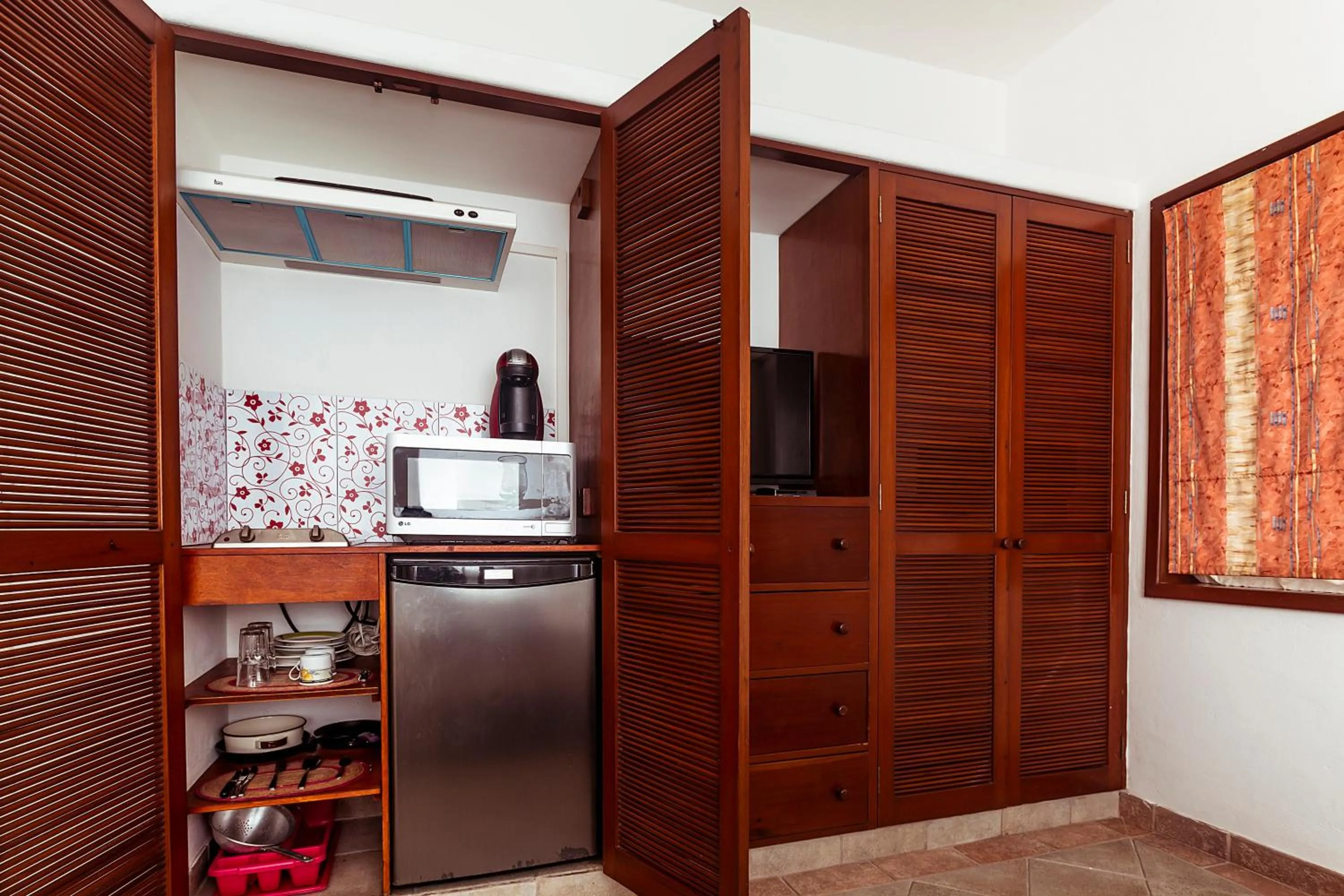 Kitchen or kitchenette in Fabiola Condo Hotel