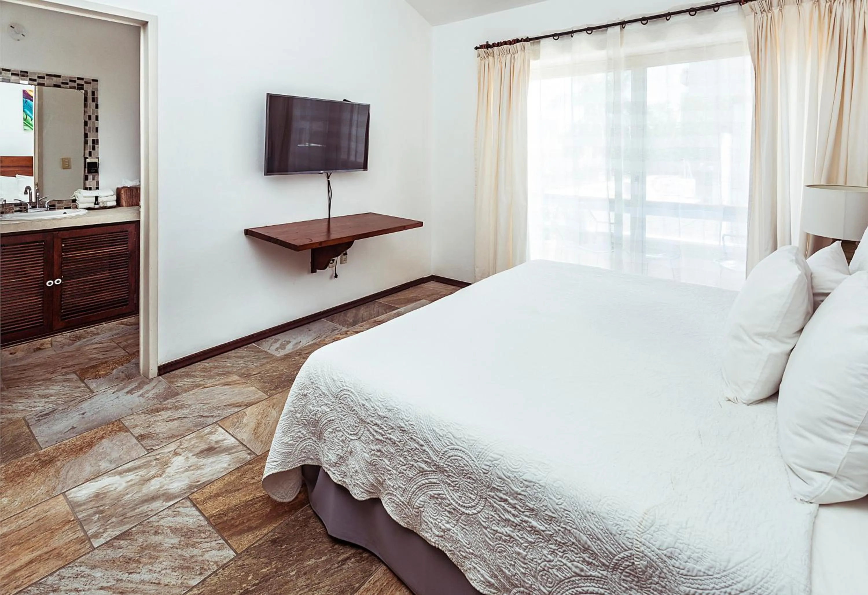 Bed in Fabiola Condo Hotel