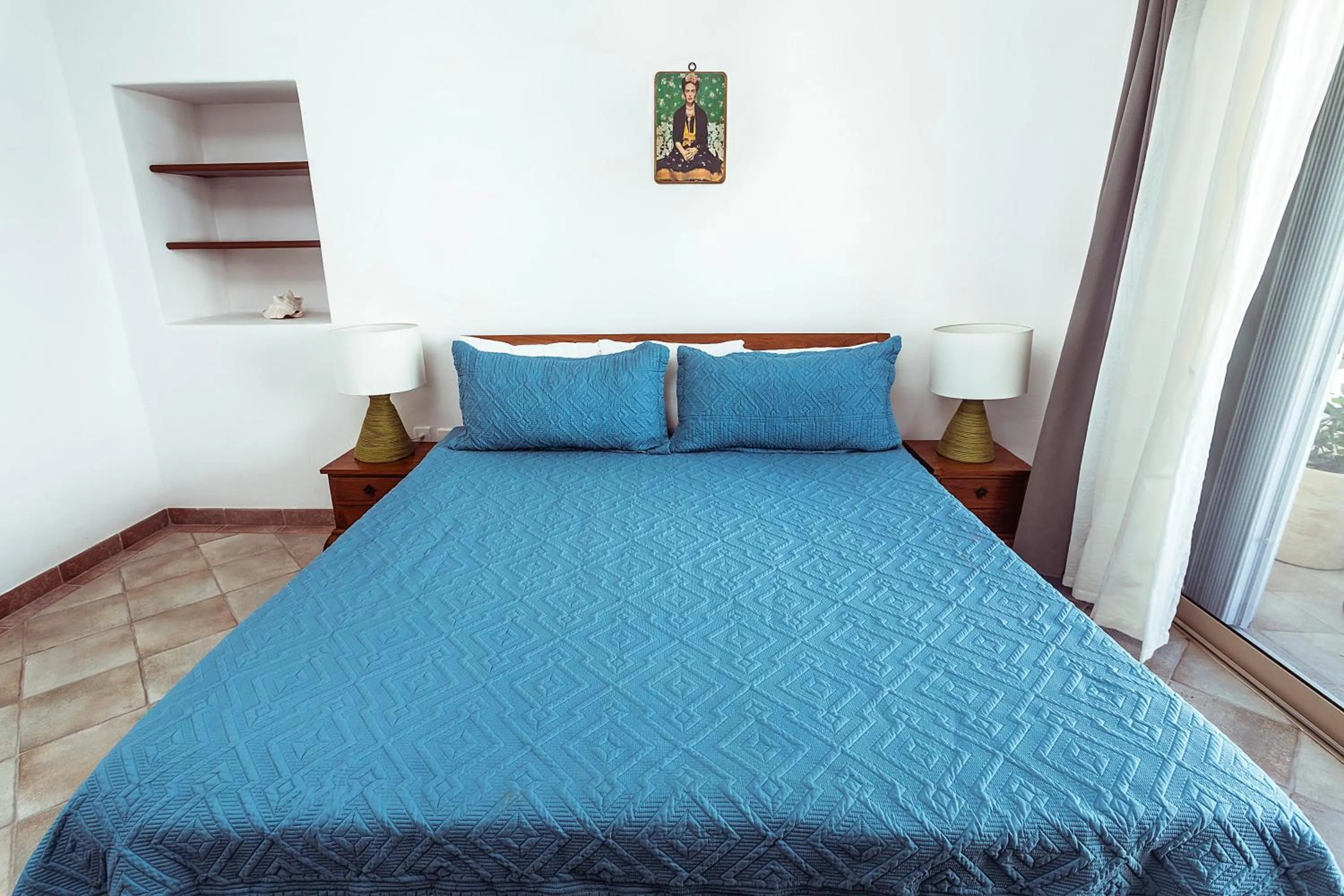 Bed in Fabiola Condo Hotel