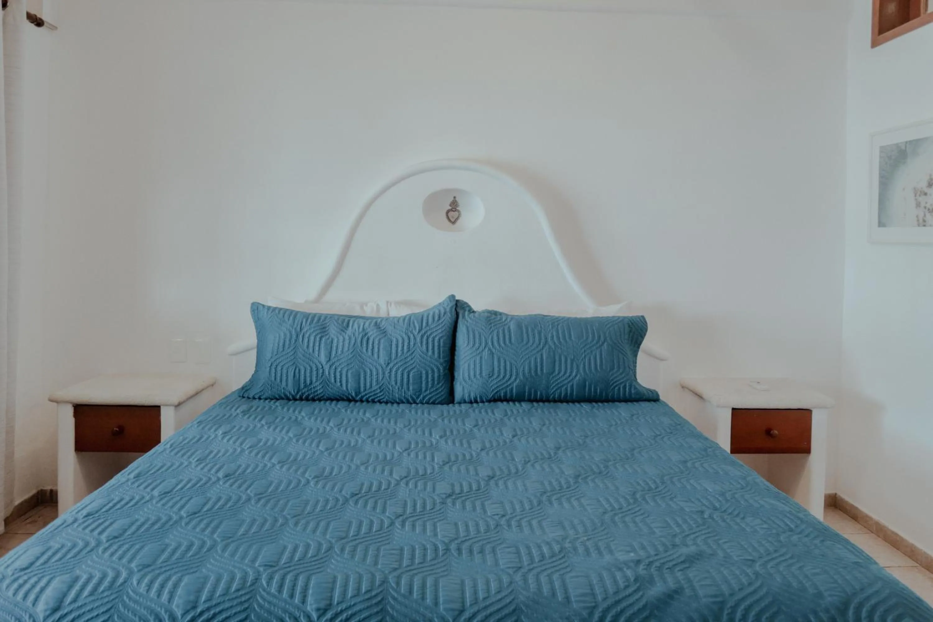 Bed in Fabiola Condo Hotel