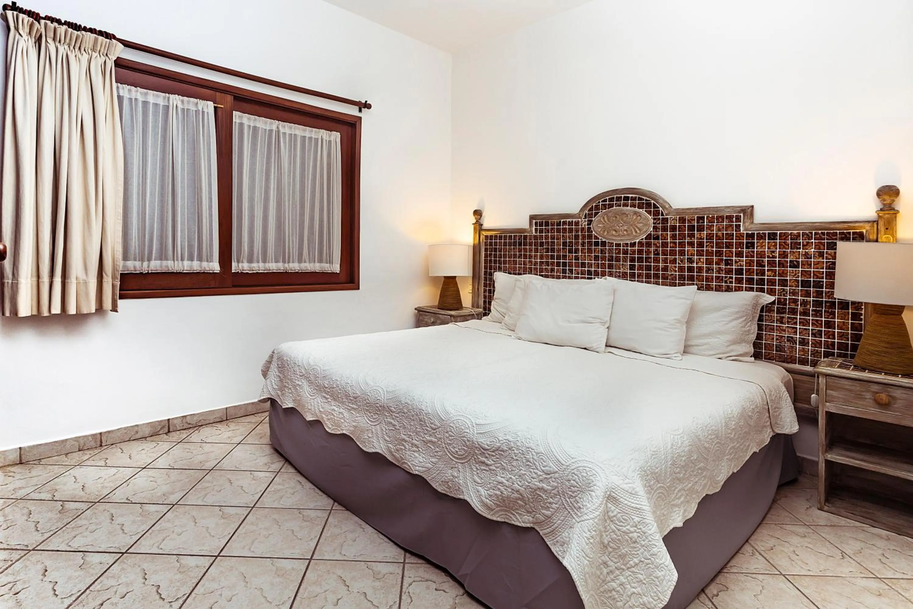 Bed in Fabiola Condo Hotel