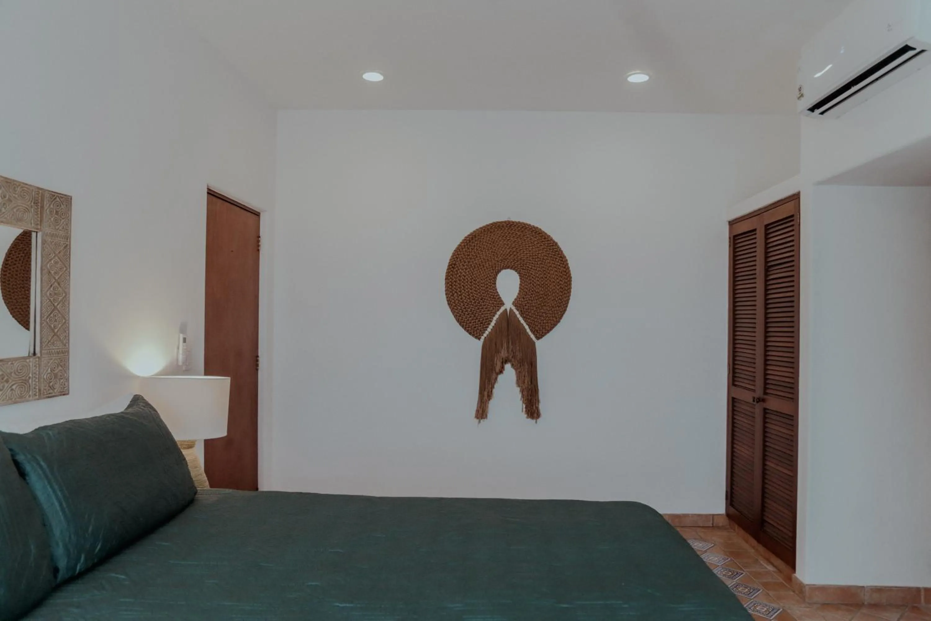 Bed in Fabiola Condo Hotel