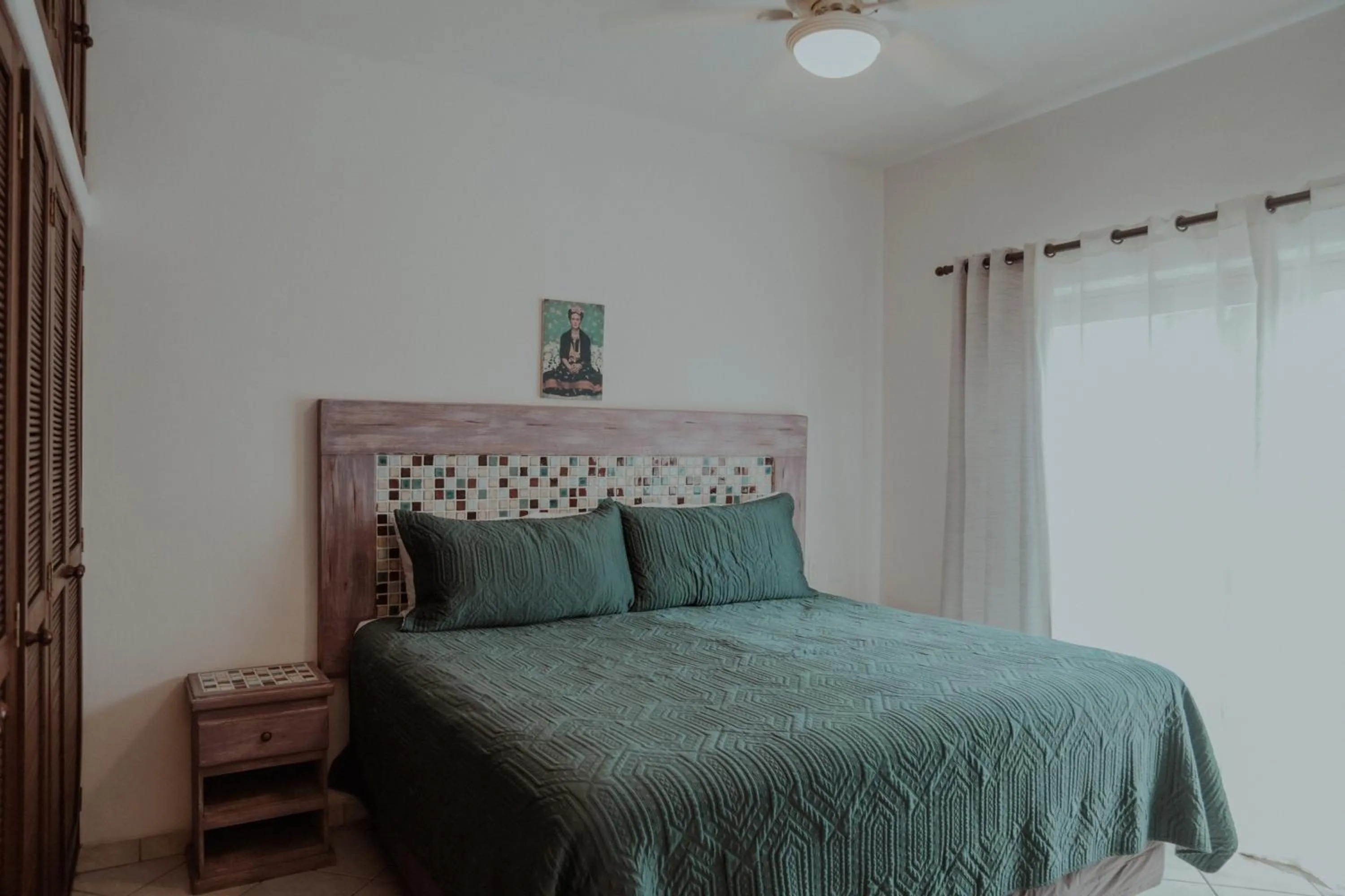 Bed in Fabiola Condo Hotel