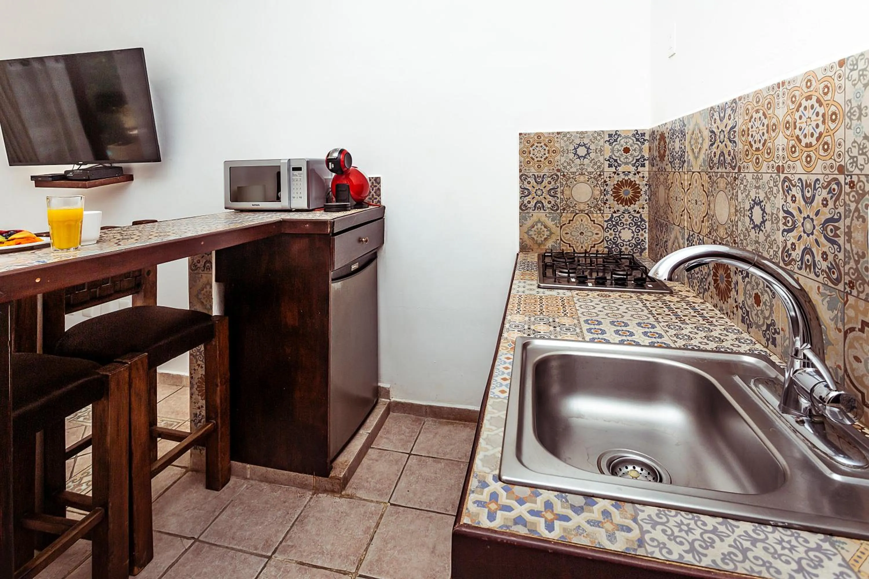Kitchen or kitchenette in Fabiola Condo Hotel