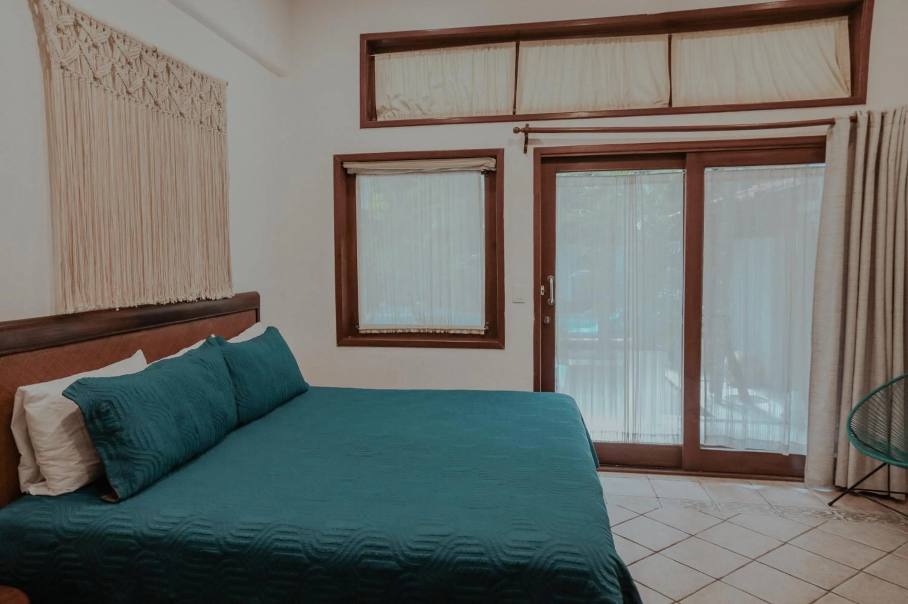 Bed in Fabiola Condo Hotel