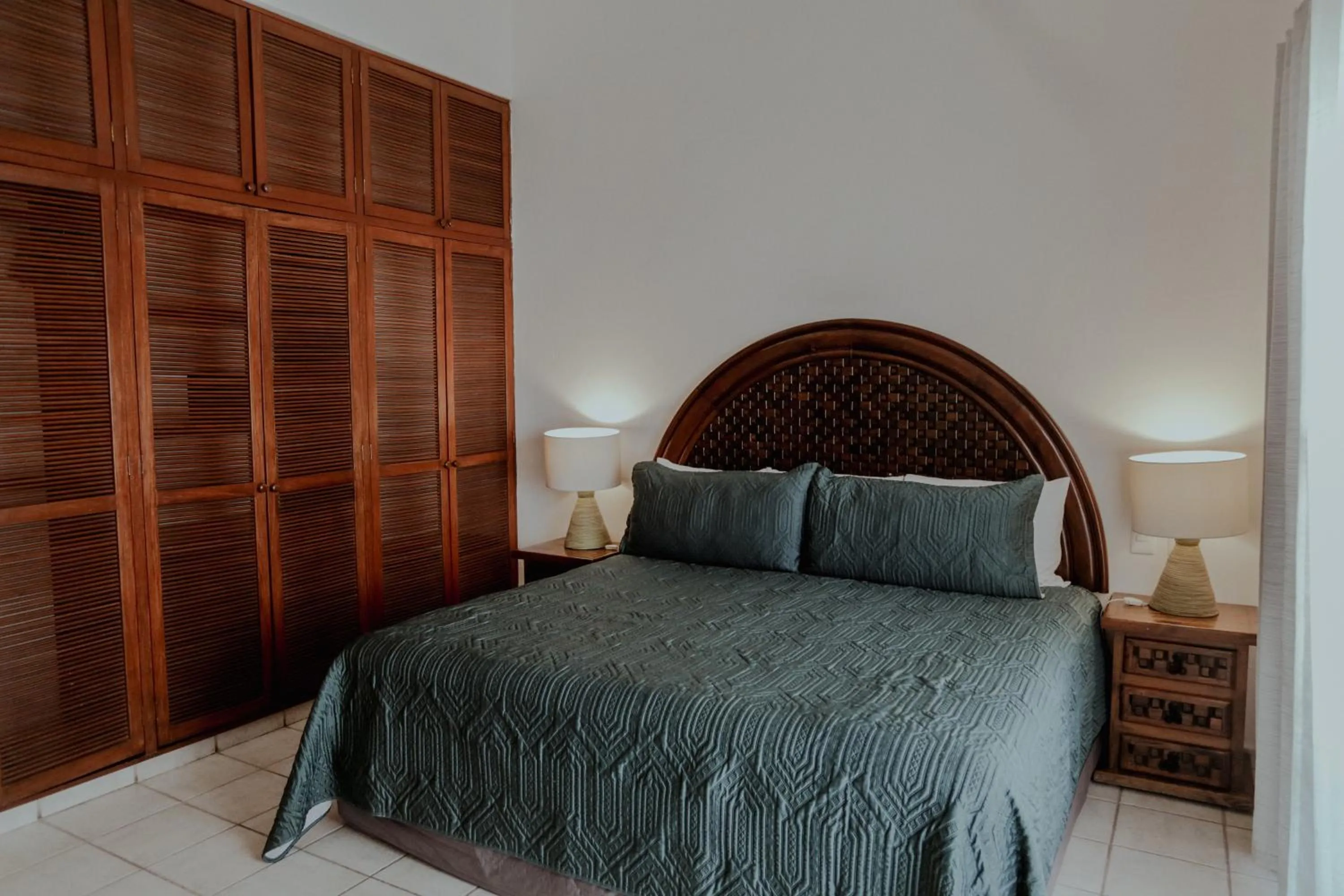 Bed in Fabiola Condo Hotel