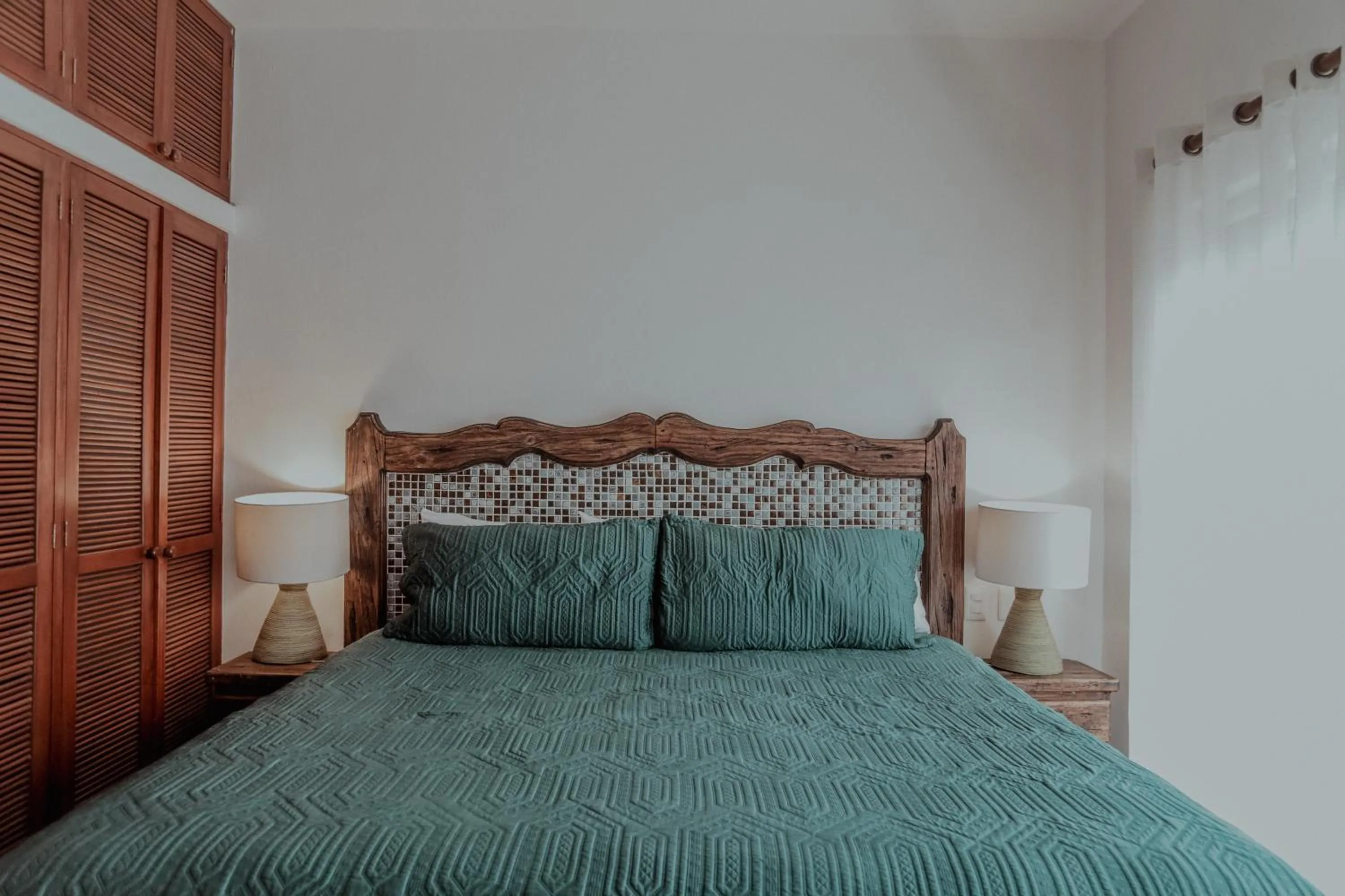 Bed in Fabiola Condo Hotel