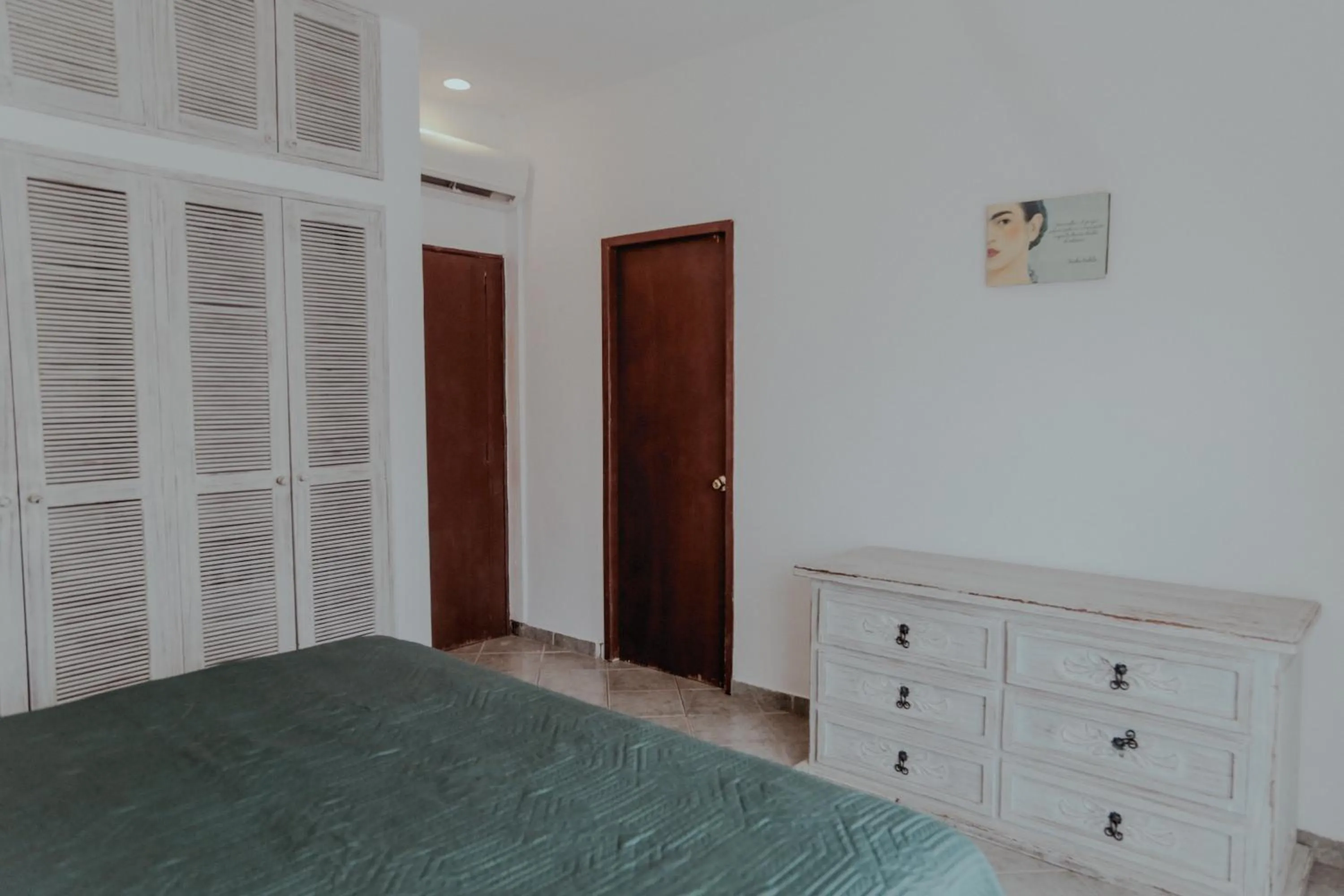 Bed in Fabiola Condo Hotel