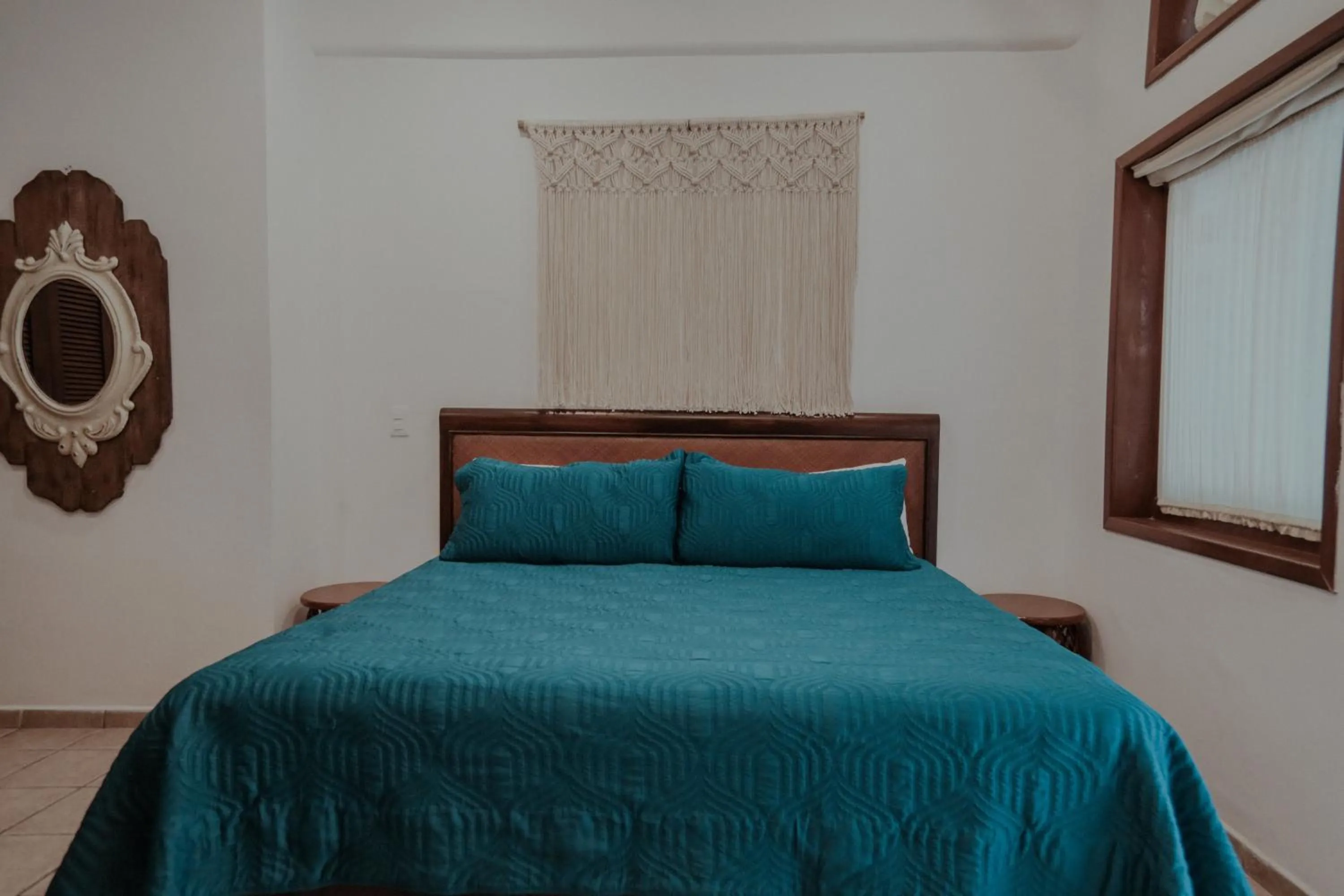 Bed in Fabiola Condo Hotel