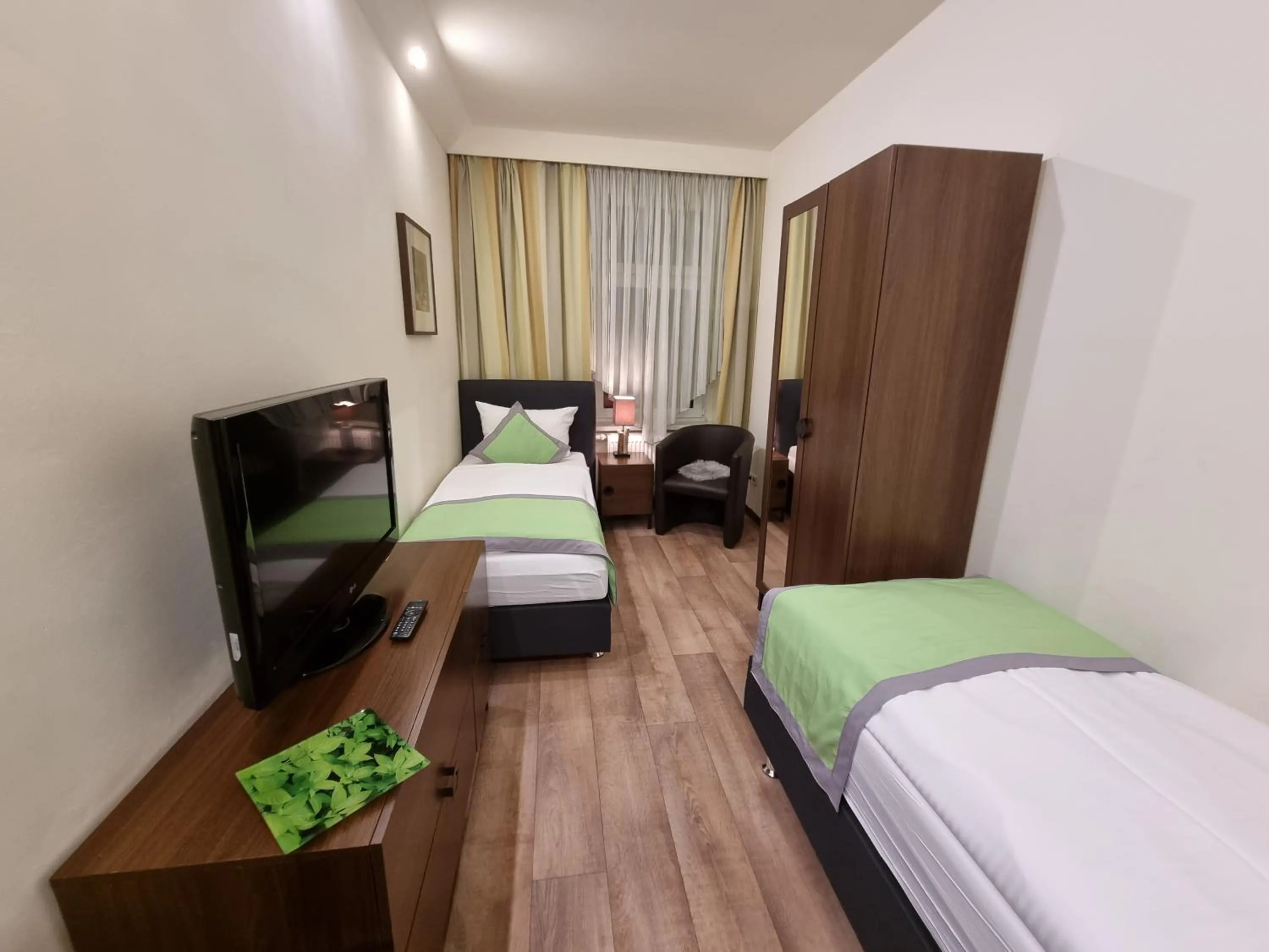 Photo of the whole room, Bed in Auenwald Hotel und Apartmenthaus