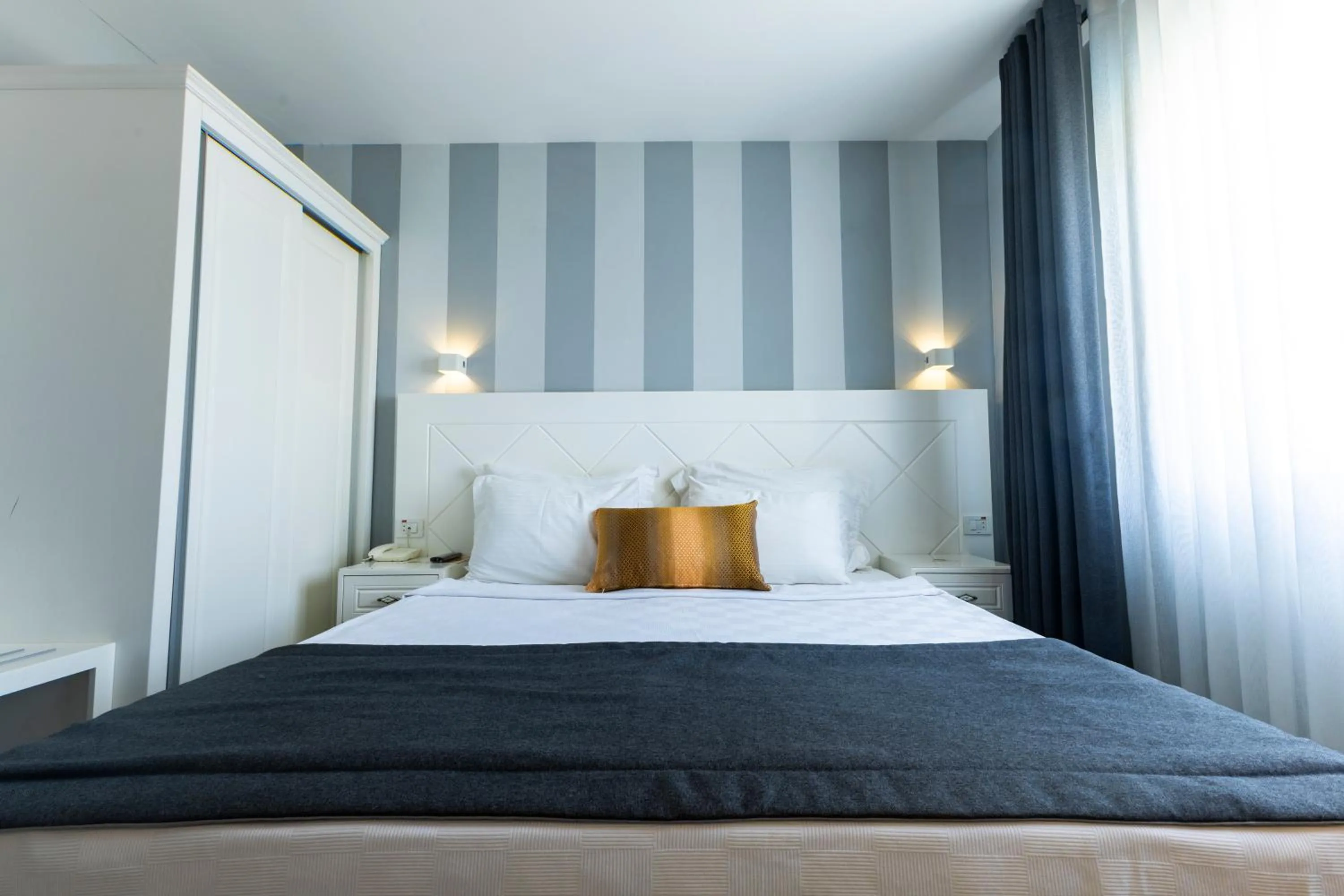 Bed in Motto Premium Hotel&Spa