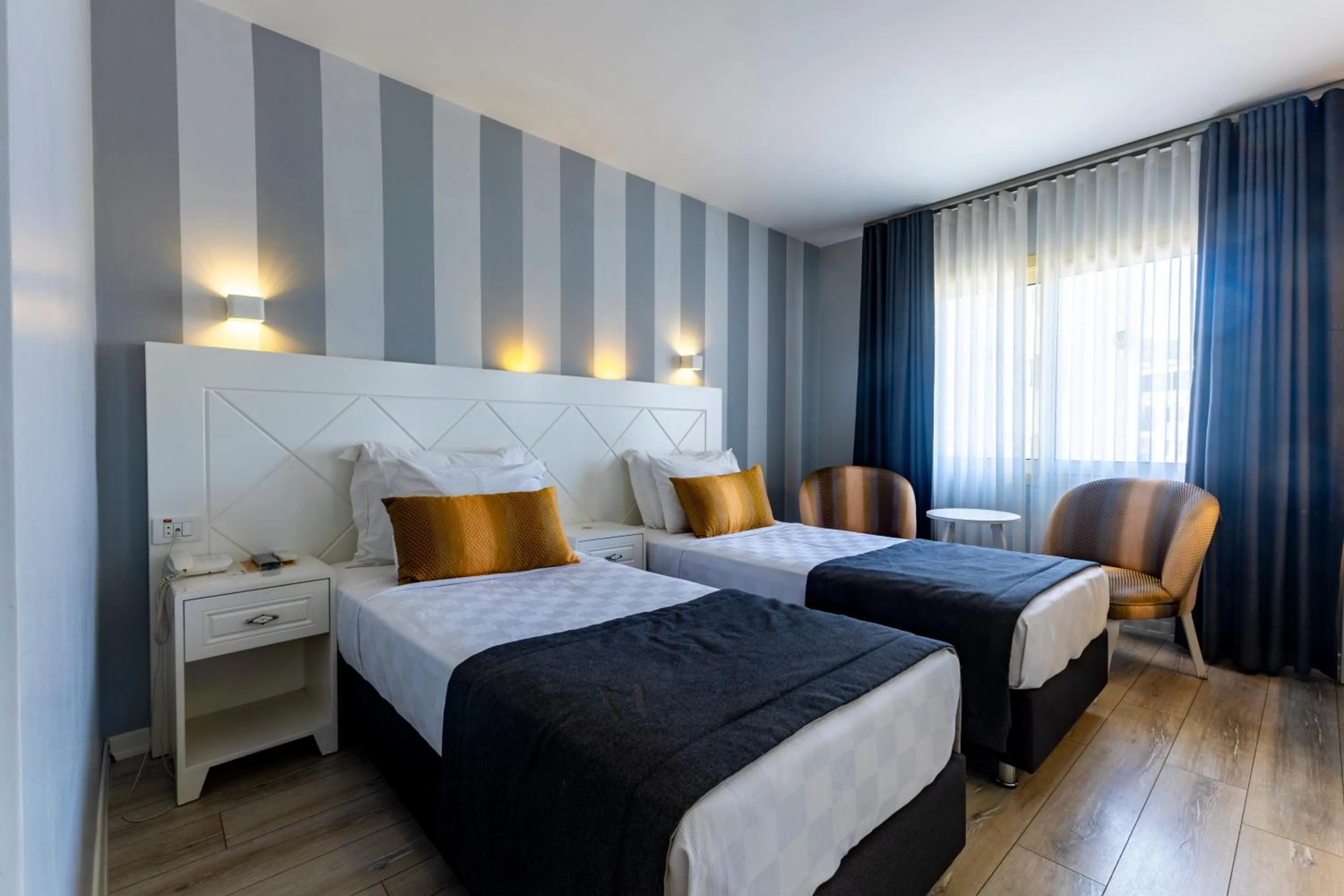 Bed in Motto Premium Hotel&Spa