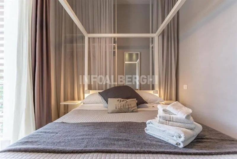 Bed in Albergo Aquila