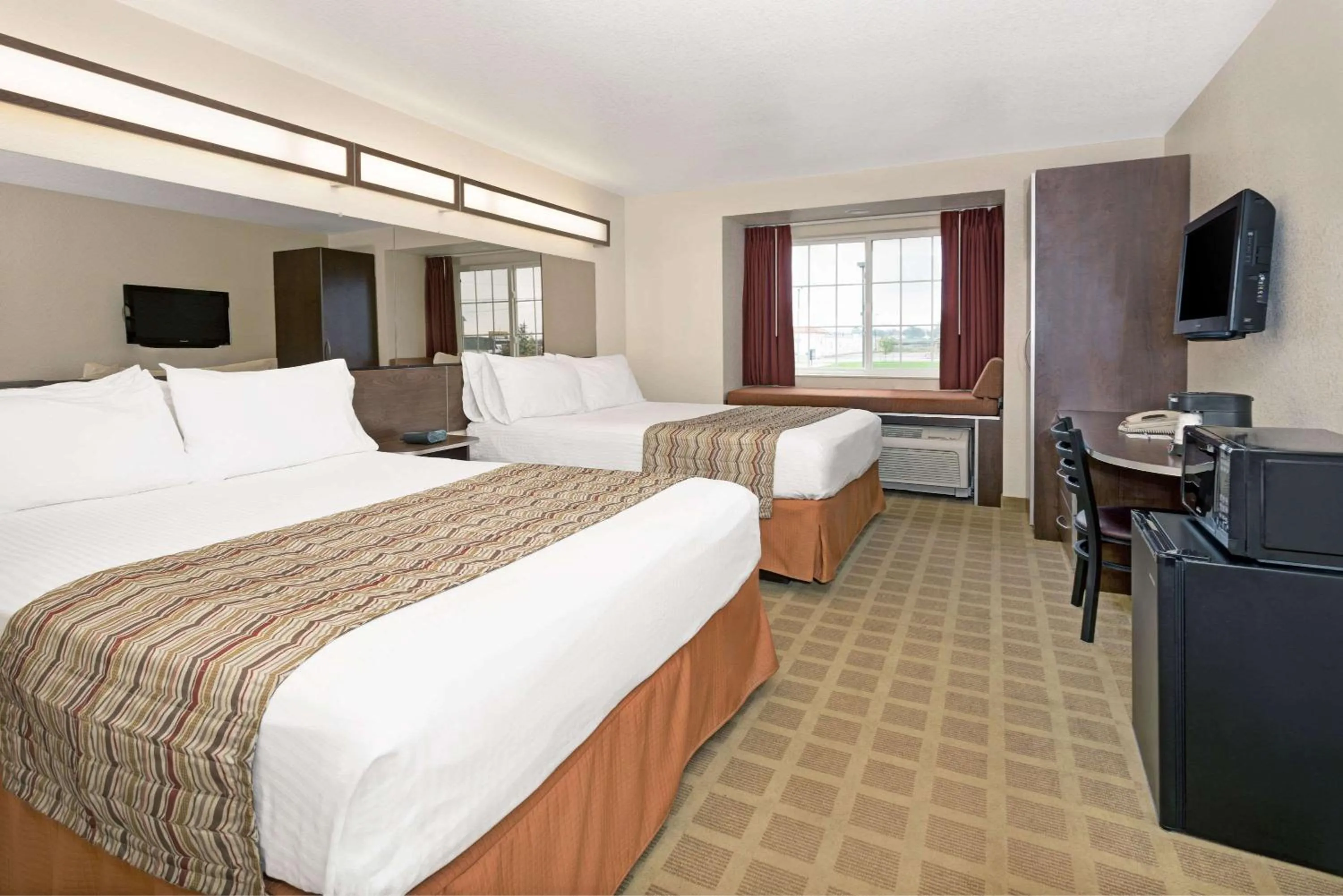 Photo of the whole room, Bed in Microtel Inn & Suites Cheyenne