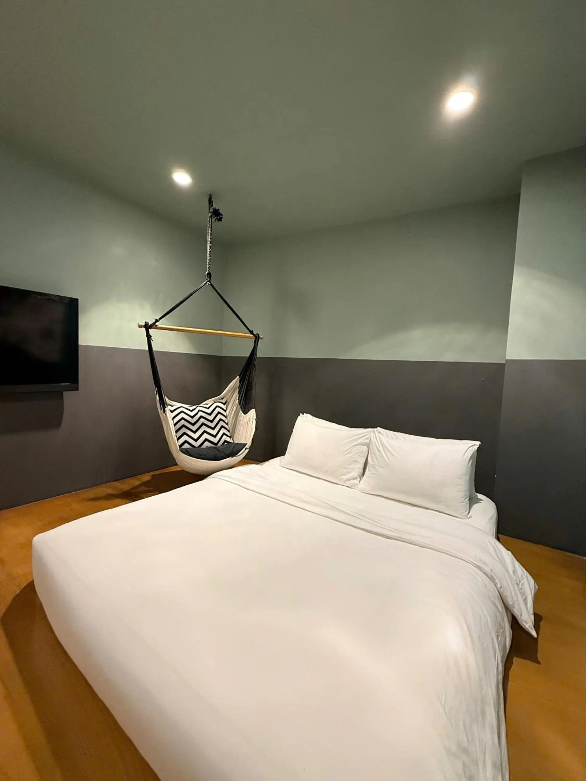 Bed in The Hammock Hotel Fine Arts Museum