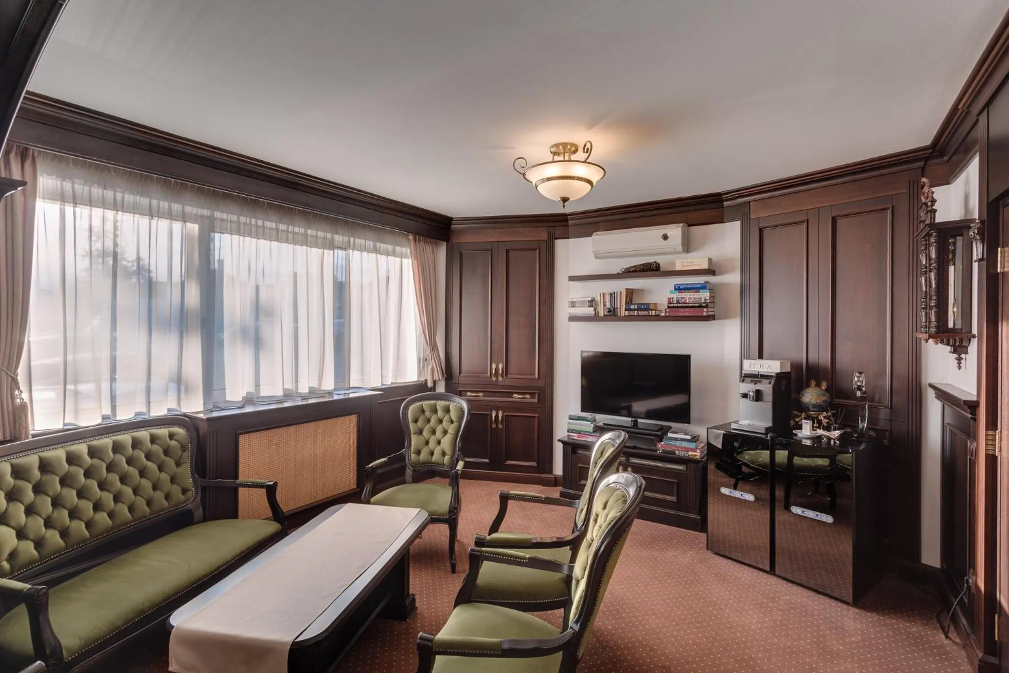 Communal lounge/ TV room in Hotel Meridian