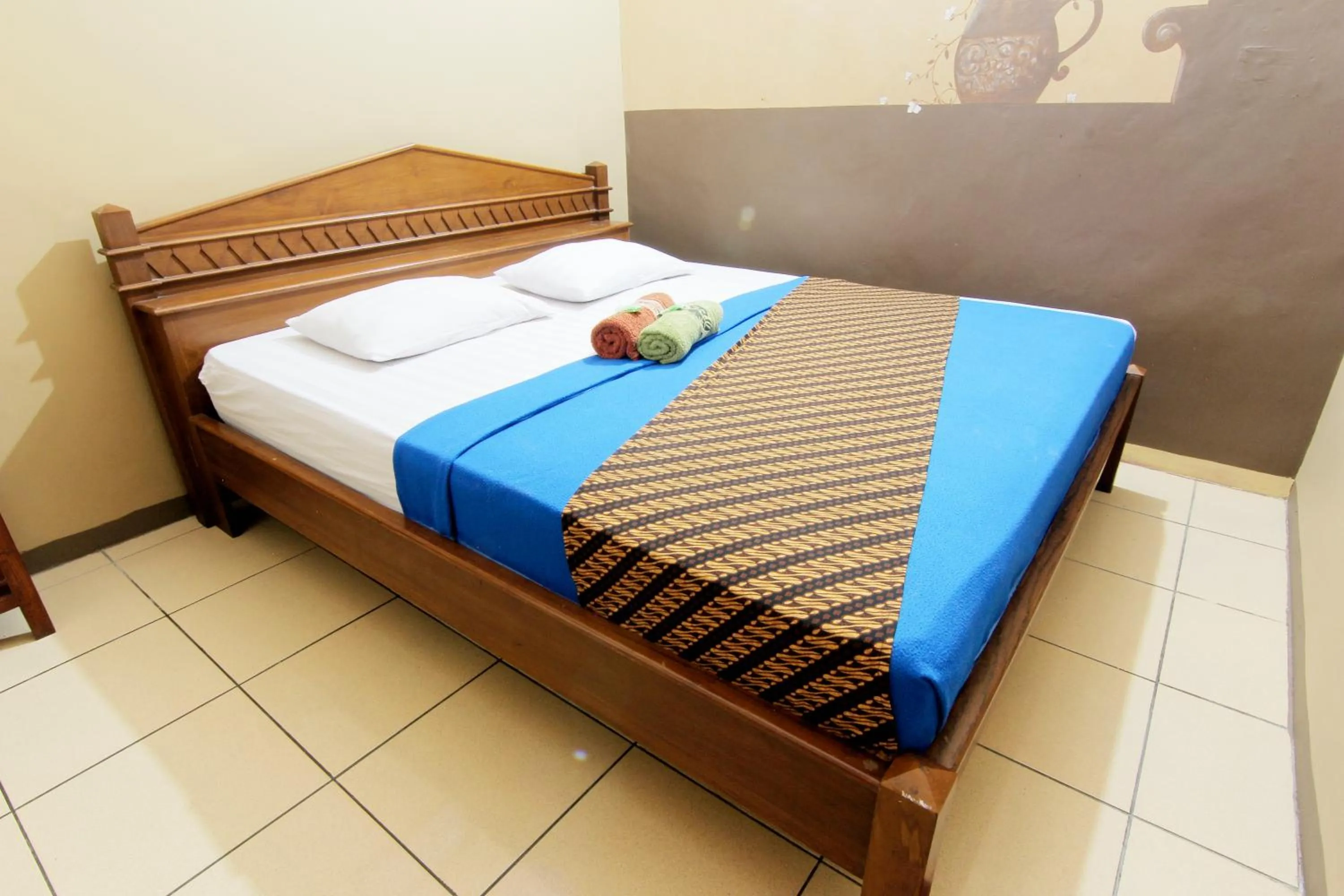 Bed in Monica Hotel Yogyakarta