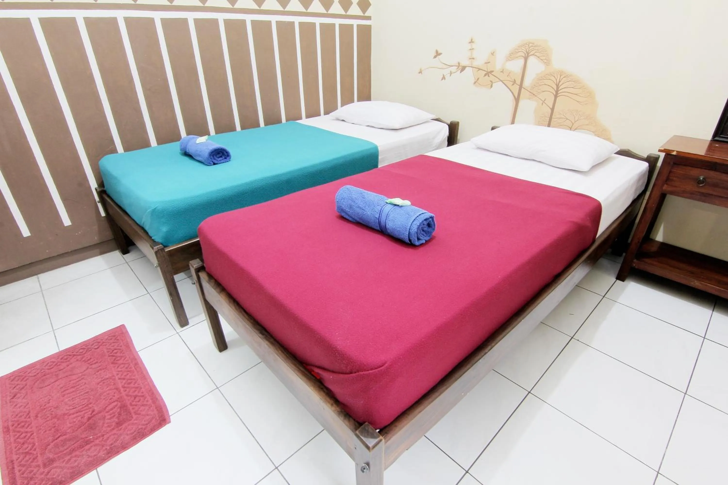 Bed in Monica Hotel Yogyakarta