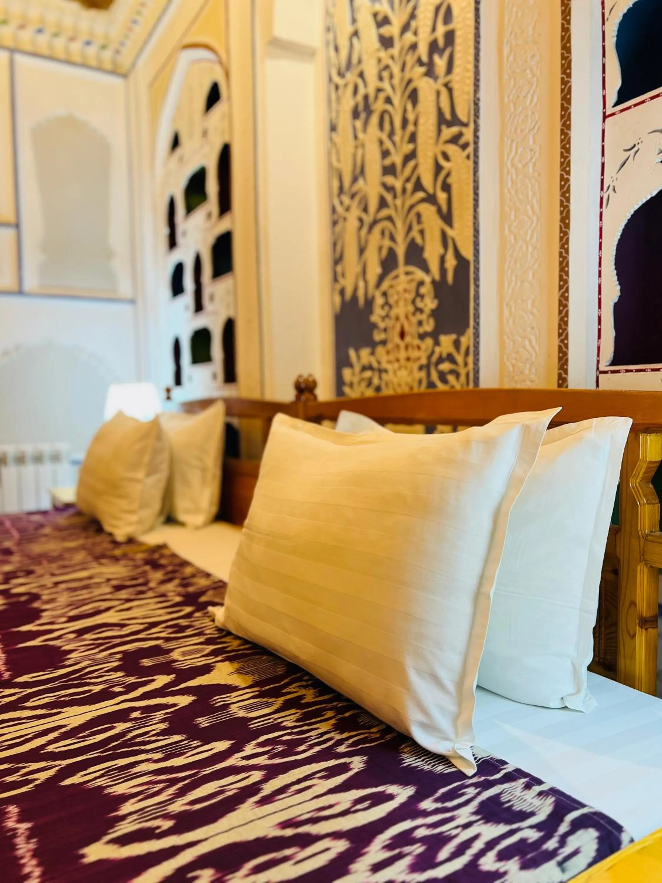 Bed in Komil Bukhara Boutique Hotel