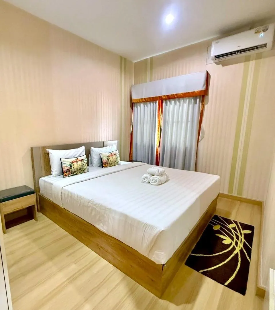 Bed in La Riva Boutique Hotel