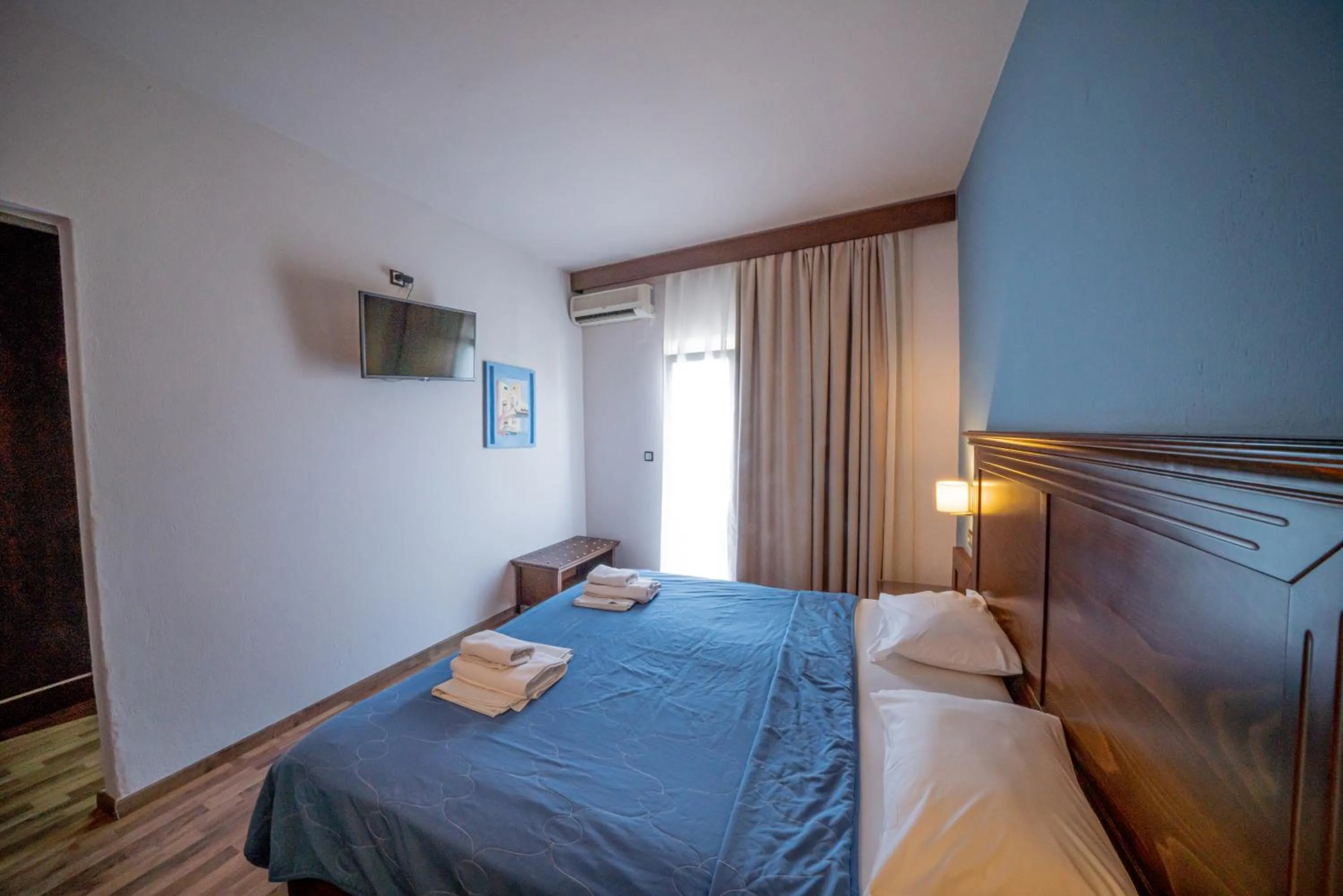 Bed in Hotel Olympion