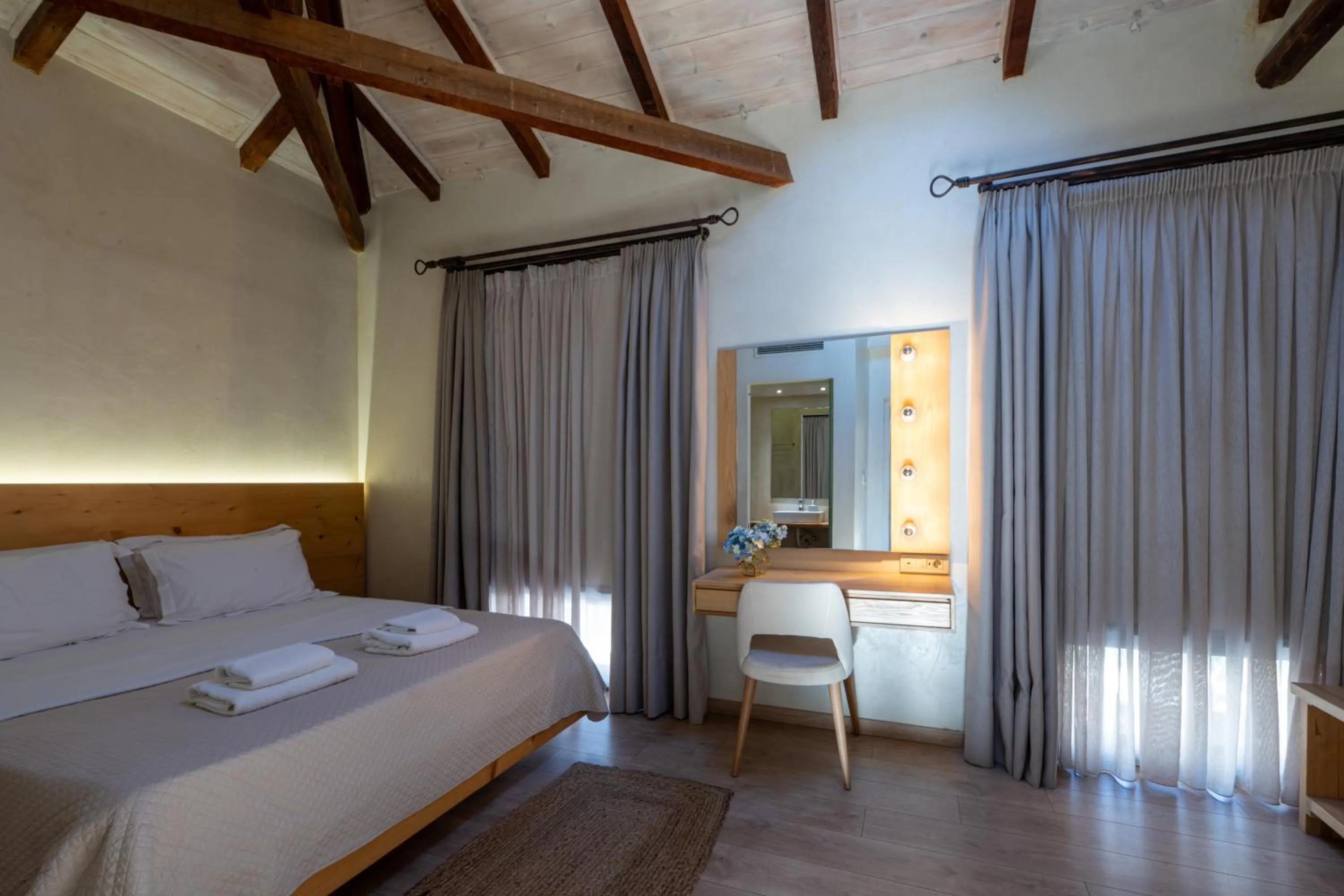 Bed in Panellinion Luxury Rooms