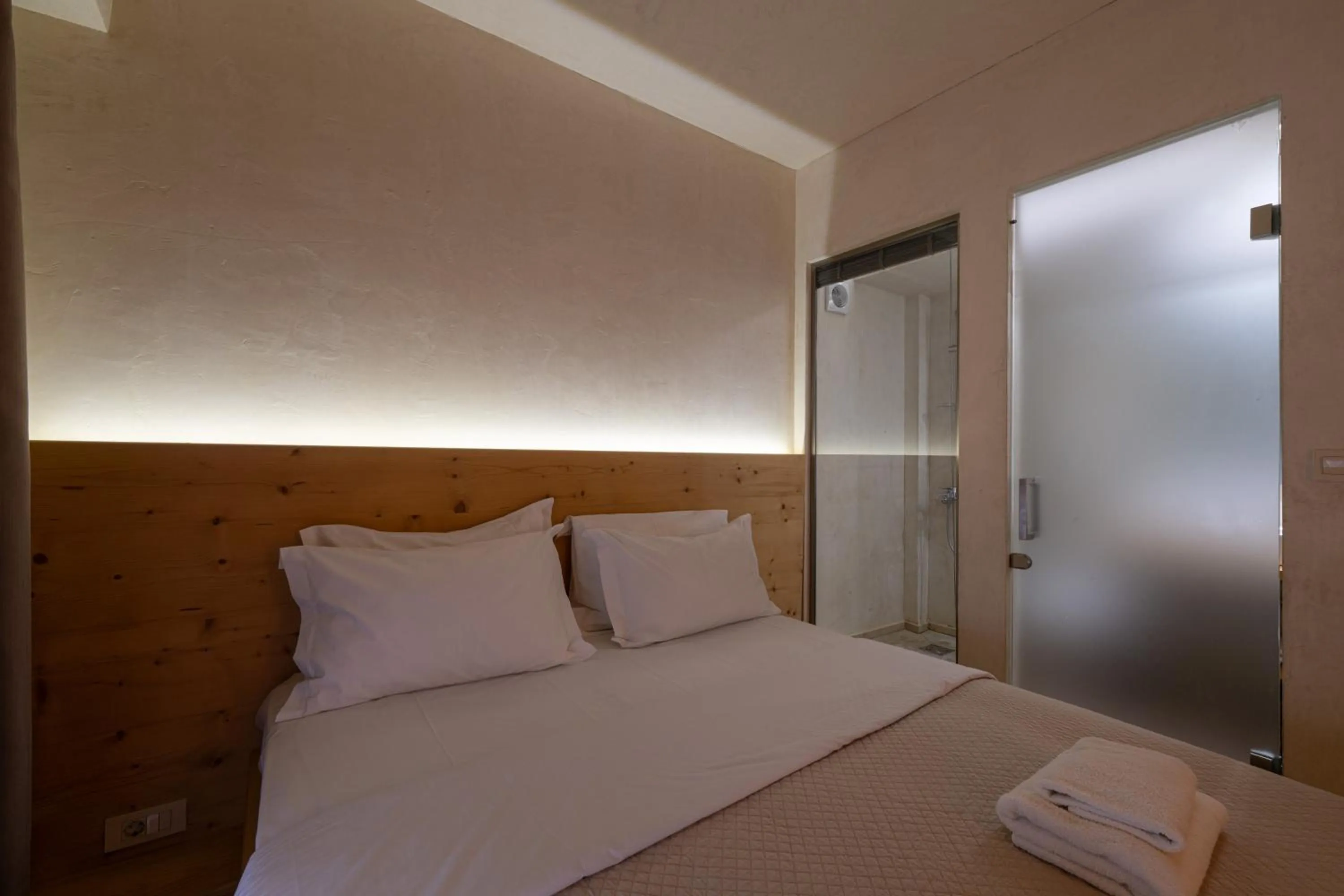 Bed in Panellinion Luxury Rooms