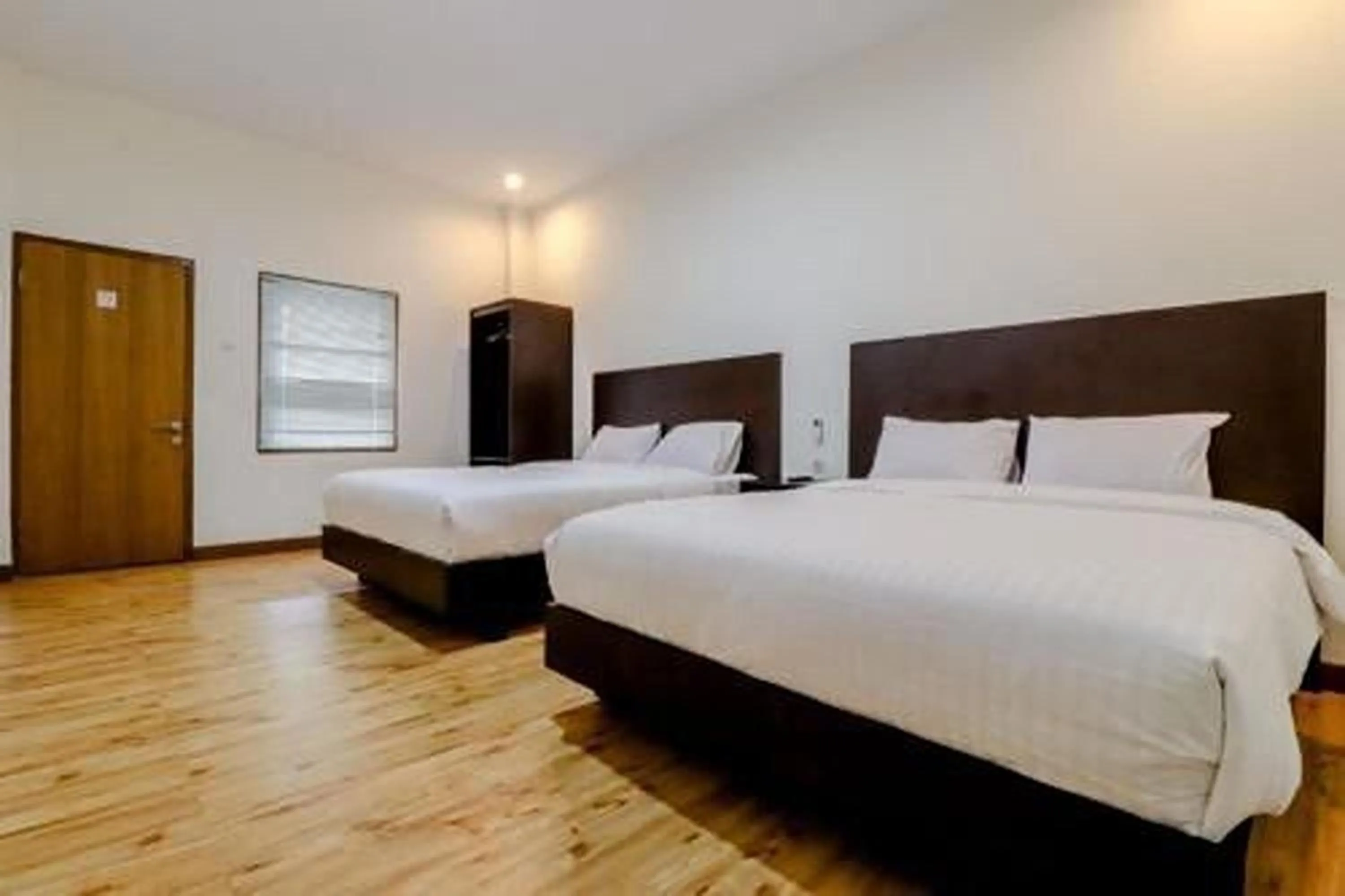 Bed in Hotel Sumaryo